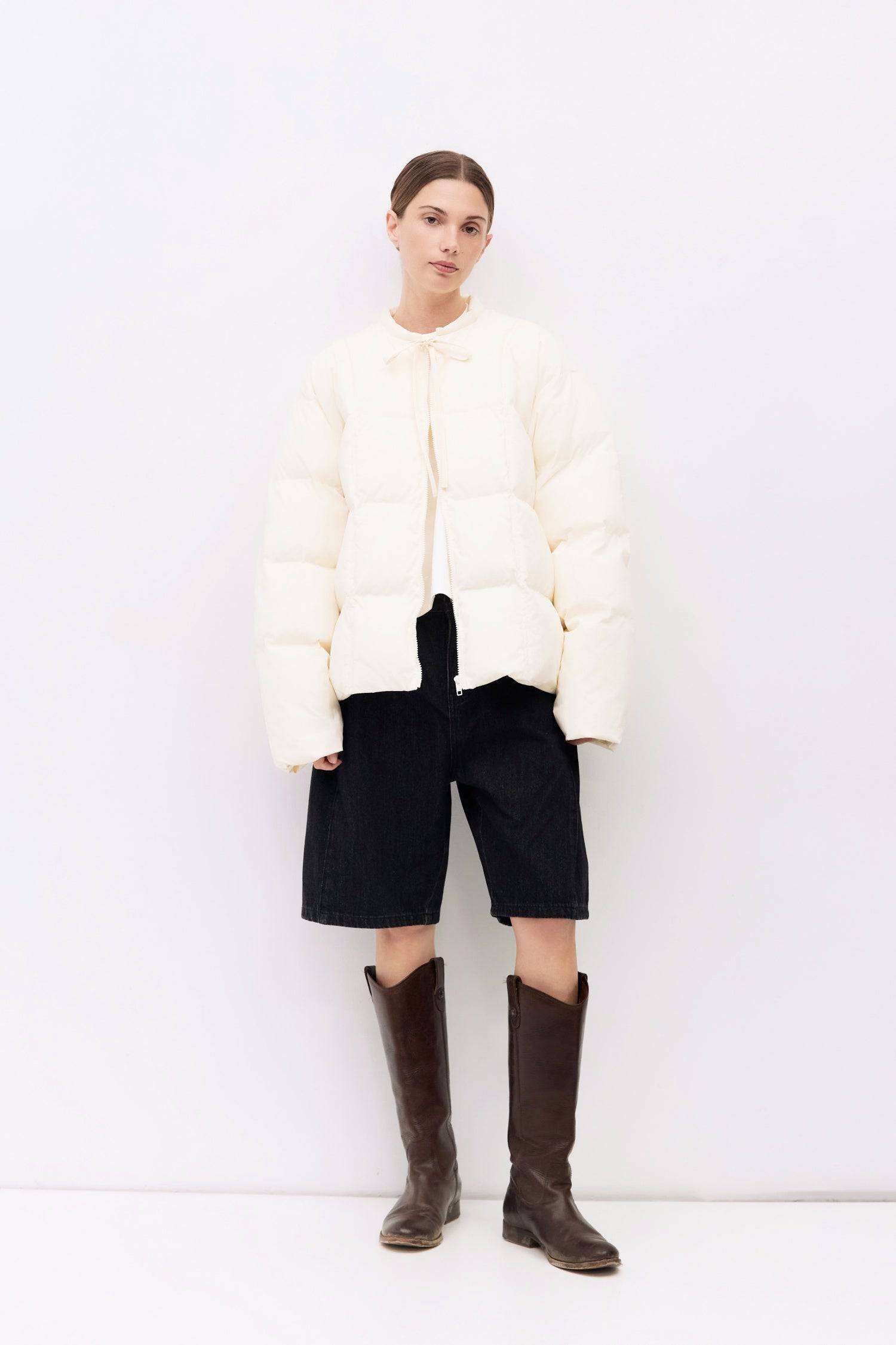 9084496347357, The Mila Jacket, Outerwear, All Row, All Row,allrow,Back Detail,Black,Casual,cf-color-black,cf-size-l,cf-size-m,cf-vendor-all-row,Coat,Comfortable,Cropped,cropped hemline,Detail,Everyday,Faux Leather,genderless,Jacket,Leather,leather jacket,Minimal,minimalist,new,Outerwear,Pleather,Polyester,Semi-Formal,Spring,statement,statement piece,Transitional,vegan leather,versatile,Womens,womens top, Information The Mila Jacket is a fully lined puffer style with quilted padding for added warmth. Design