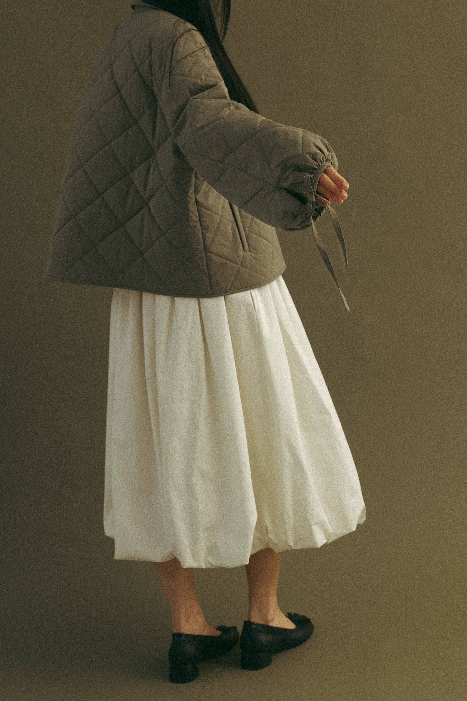 8466464997597, The Bella Skirt, Skirt, All Row, Black,Blue,Bottom,Bottoms,bubble,bubble skirt,cf-color-black,cf-color-natural,cf-size-l,cf-size-m,cf-size-s,Comfortable,Elastic,Elastic Waistband,everyday,flowy,ivory,Light Blue,matching,Midi Skirt,Mod Ref,Skirt,skirts,spring,Summer,womens, Information The Bella Skirt is a playful midi-length bubble skirt. It features an elasticated waist for a comfortable and adjustable fit. The length and bubble effect hem add volume and movement to the silhouette. Pair this