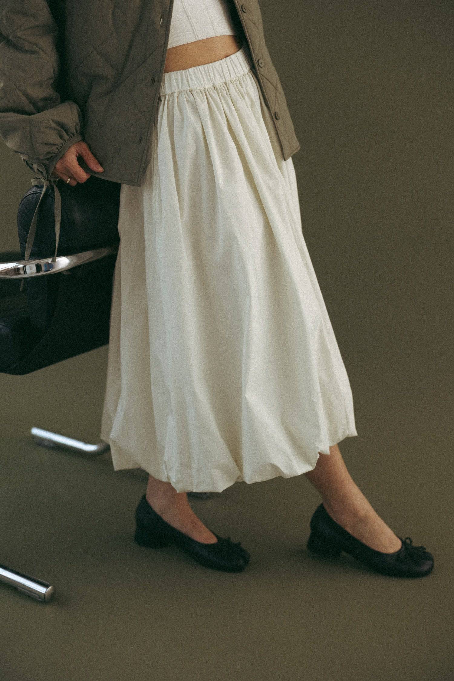 8466464997597, The Bella Skirt, Skirt, All Row, Black,Blue,Bottom,Bottoms,bubble,bubble skirt,cf-color-black,cf-color-natural,cf-size-l,cf-size-m,cf-size-s,Comfortable,Elastic,Elastic Waistband,everyday,flowy,ivory,Light Blue,matching,Midi Skirt,Mod Ref,Skirt,skirts,spring,Summer,womens, Information The Bella Skirt is a playful midi-length bubble skirt. It features an elasticated waist for a comfortable and adjustable fit. The length and bubble effect hem add volume and movement to the silhouette. Pair this