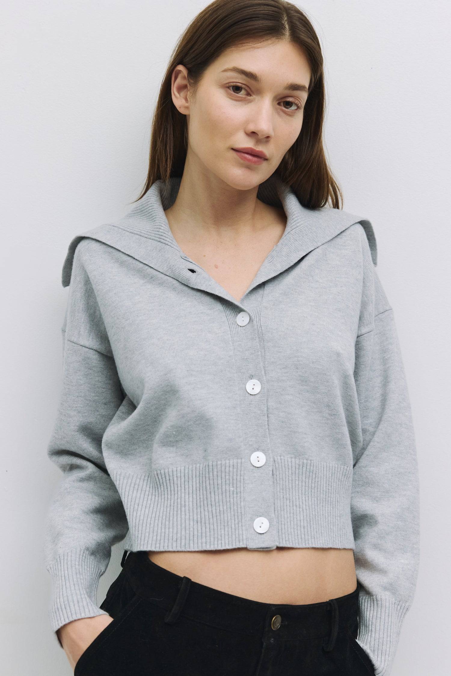 8854675685597, The Abrams Cardigan, Tops, All Row, All Row,allrow,brown,Button up,buttons,Cardigan,cf-color-black,cf-color-brown,cf-size-l,cf-size-m,cf-size-s,Collar,collared,Comfortable,Cropped,cropped hemline,Everyday,fold over,Grey,Heather Grey,longsleeve,Transitional,wide-collar,Womens,womens top, Information The Abrams Cardigan is a soft knit cardigan featuring a wide folded collar and tonal mother-of-pearl buttons. The cropped length and relaxed fit complement high-waisted bottoms or midi skirts. Deta