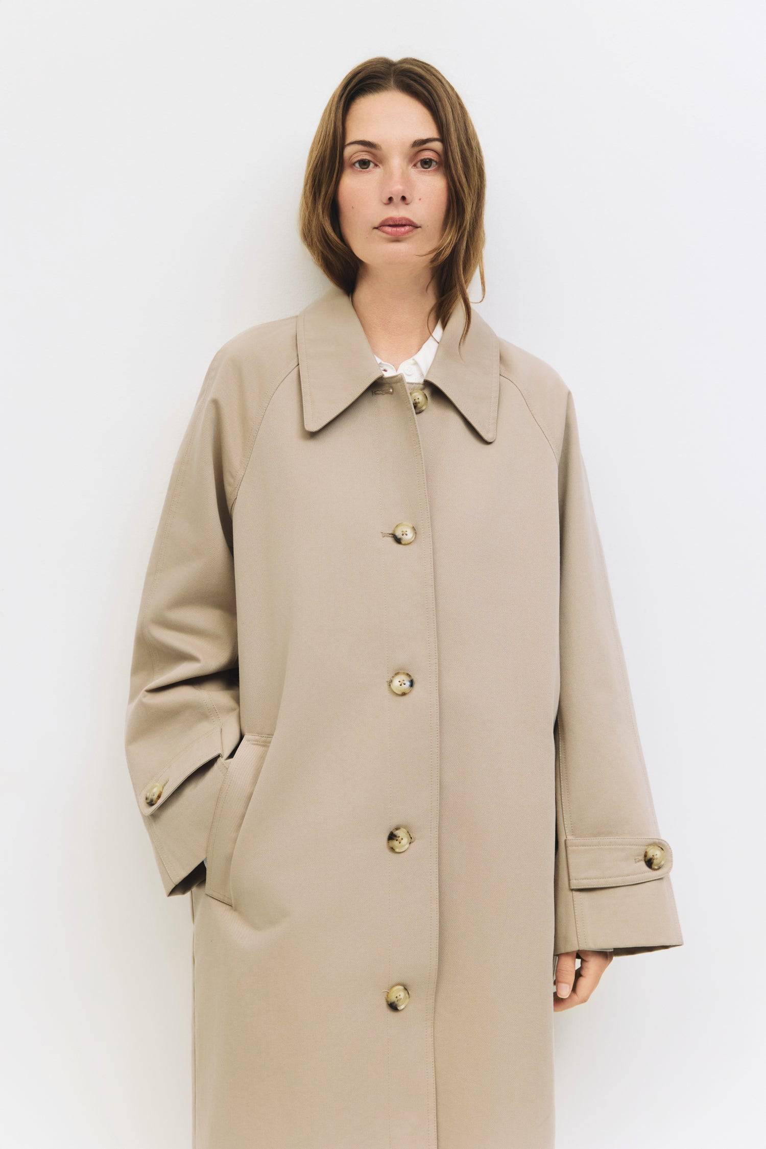 9045717582045, The Serena Coat, Outerwear, Mod Ref, beige,cf-color-beige,cf-color-olive,cf-size-l,cf-size-m,cf-size-s,cf-vendor-mod-ref,Coat,coat jacket,Comfort,Comfortable,Detail,Details,Fall,layer,layering,Layers,Long,Long Sleeve,midi length,modref,new,Olive,Outerwear,Oversized,Oversized Coat,Peacoat,Pockets,scarf,Spring,Summer,Transitional,Trench,Trench Coat,Womens, Information The Serena Coat blends timeless tailoring with contemporary ease, featuring a pointed collar and raglan sleeves for a relaxed ye