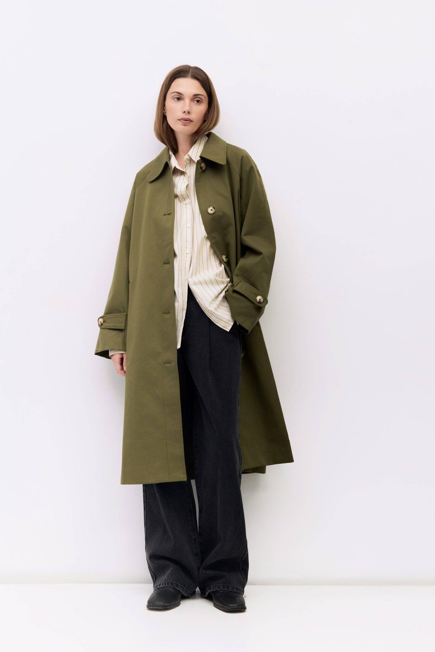 9045717582045, The Serena Coat, Outerwear, Mod Ref, beige,cf-color-beige,cf-color-olive,cf-size-l,cf-size-m,cf-size-s,cf-vendor-mod-ref,Coat,coat jacket,Comfort,Comfortable,Detail,Details,Fall,layer,layering,Layers,Long,Long Sleeve,midi length,modref,new,Olive,Outerwear,Oversized,Oversized Coat,Peacoat,Pockets,scarf,Spring,Summer,Transitional,Trench,Trench Coat,Womens, Information The Serena Coat blends timeless tailoring with contemporary ease, featuring a pointed collar and raglan sleeves for a relaxed ye