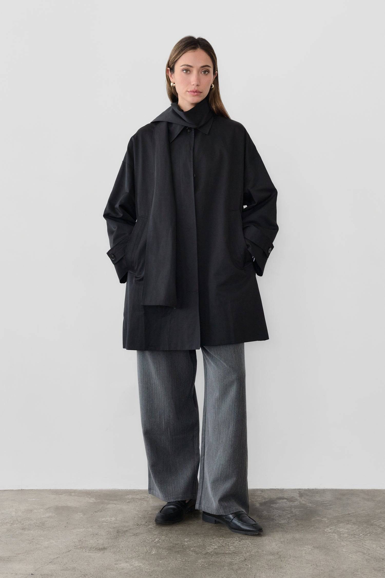 8828669198557, The Cove Coat, Outerwear, Mod Ref, attached scarf,Black,cf-color-black,cf-color-khaki,cf-size-l,cf-size-m,cf-size-s,cf-vendor-mod-ref,Coat,coat jacket,Comfort,Comfortable,Detail,Details,Fall,layer,layering,Layers,Long,Long Sleeve,modref,new,Outerwear,Oversized,Oversized Coat,Peacoat,Pockets,scarf,Spring,Summer,Transitional,Trench,Trench Coat,Womens, Information The Cove Coat offers an effortless chic style. It sits slightly below the hips for a trendy look and includes an attachable scarf for