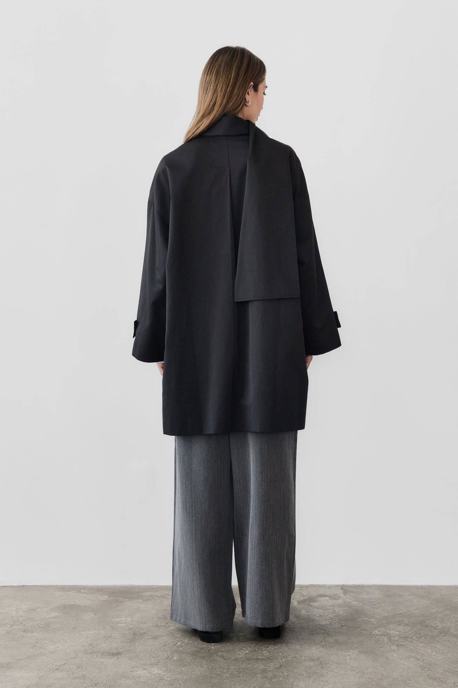 8828669198557, The Cove Coat, Outerwear, Mod Ref, attached scarf,Black,cf-color-black,cf-color-khaki,cf-size-l,cf-size-m,cf-size-s,cf-vendor-mod-ref,Coat,coat jacket,Comfort,Comfortable,Detail,Details,Fall,layer,layering,Layers,Long,Long Sleeve,modref,new,Outerwear,Oversized,Oversized Coat,Peacoat,Pockets,scarf,Spring,Summer,Transitional,Trench,Trench Coat,Womens, Information The Cove Coat offers an effortless chic style. It sits slightly below the hips for a trendy look and includes an attachable scarf for