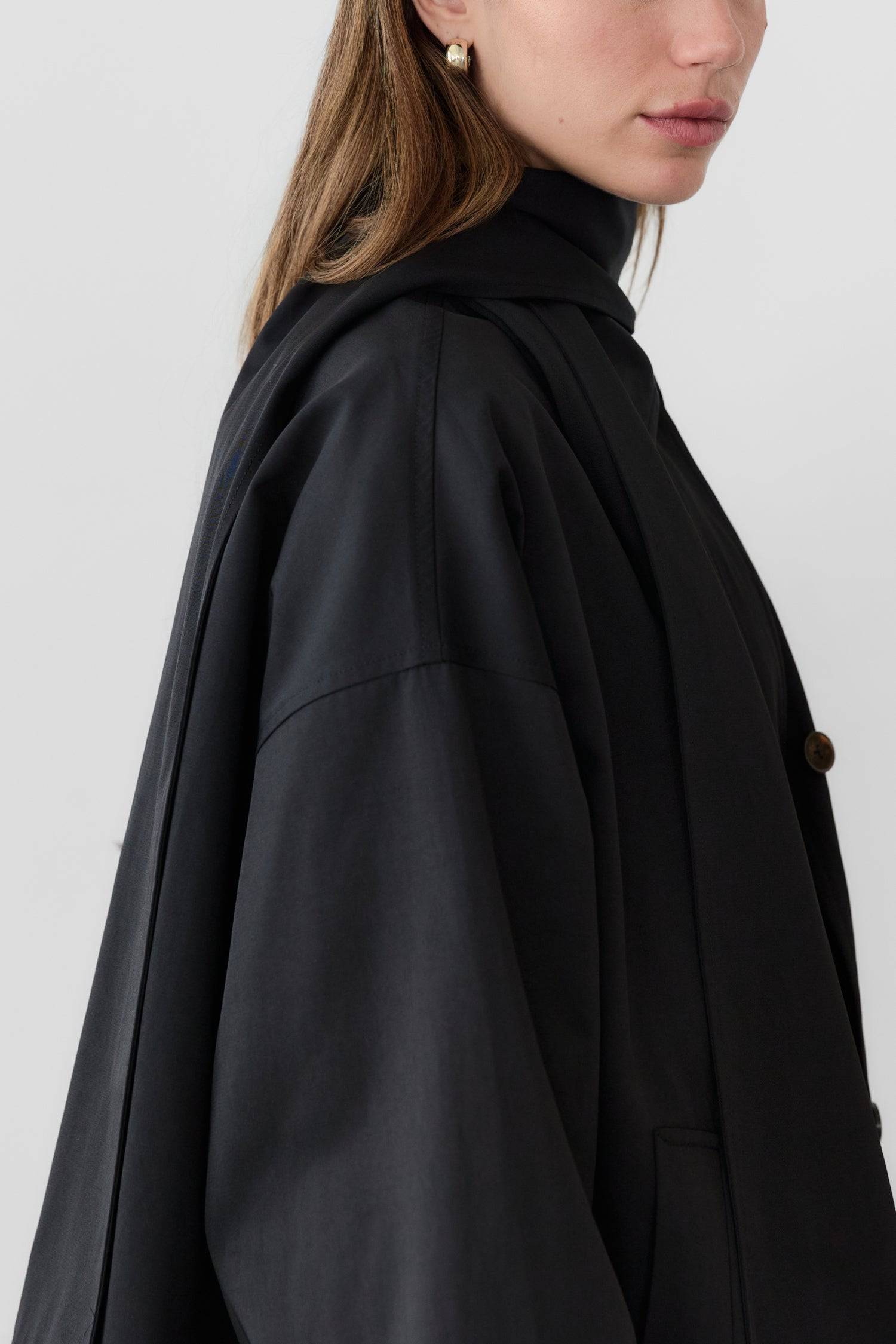 8828669198557, The Cove Coat, Outerwear, Mod Ref, attached scarf,Black,cf-color-black,cf-color-khaki,cf-size-l,cf-size-m,cf-size-s,cf-vendor-mod-ref,Coat,coat jacket,Comfort,Comfortable,Detail,Details,Fall,layer,layering,Layers,Long,Long Sleeve,modref,new,Outerwear,Oversized,Oversized Coat,Peacoat,Pockets,scarf,Spring,Summer,Transitional,Trench,Trench Coat,Womens, Information The Cove Coat offers an effortless chic style. It sits slightly below the hips for a trendy look and includes an attachable scarf for