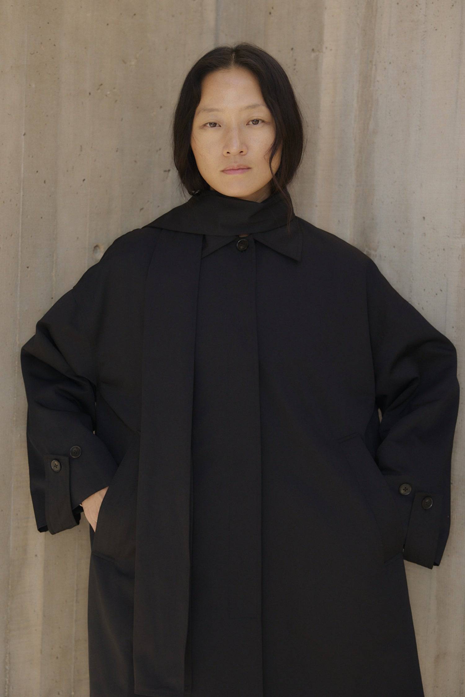 8828669198557, The Cove Coat, Outerwear, Mod Ref, attached scarf,Black,cf-color-black,cf-color-khaki,cf-size-l,cf-size-m,cf-size-s,cf-vendor-mod-ref,Coat,coat jacket,Comfort,Comfortable,Detail,Details,Fall,layer,layering,Layers,Long,Long Sleeve,modref,new,Outerwear,Oversized,Oversized Coat,Peacoat,Pockets,scarf,Spring,Summer,Transitional,Trench,Trench Coat,Womens, Information The Cove Coat offers an effortless chic style. It sits slightly below the hips for a trendy look and includes an attachable scarf for