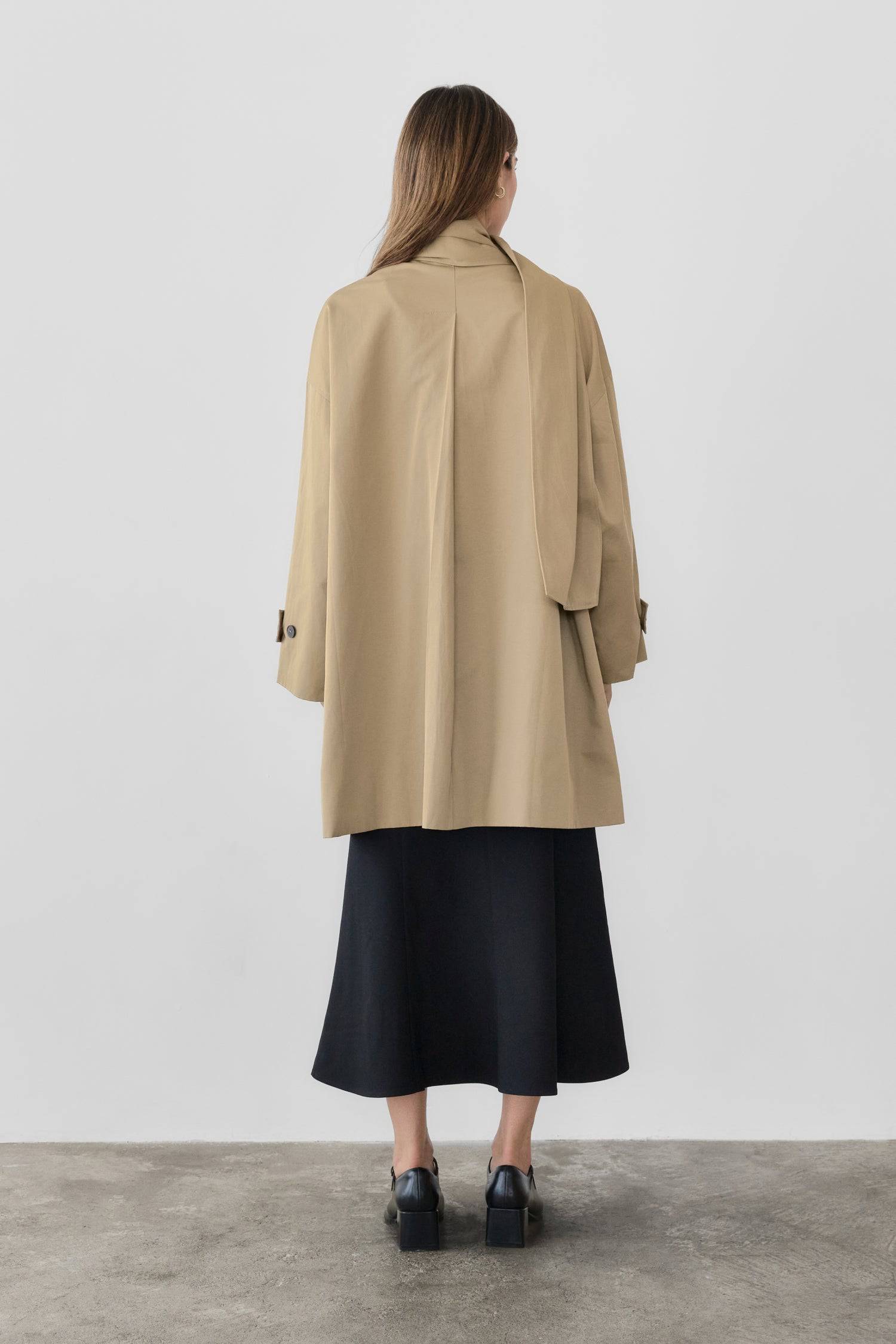 8828669198557, The Cove Coat, Outerwear, Mod Ref, attached scarf,Black,cf-color-black,cf-color-khaki,cf-size-l,cf-size-m,cf-size-s,cf-vendor-mod-ref,Coat,coat jacket,Comfort,Comfortable,Detail,Details,Fall,layer,layering,Layers,Long,Long Sleeve,modref,new,Outerwear,Oversized,Oversized Coat,Peacoat,Pockets,scarf,Spring,Summer,Transitional,Trench,Trench Coat,Womens, Information The Cove Coat offers an effortless chic style. It sits slightly below the hips for a trendy look and includes an attachable scarf for