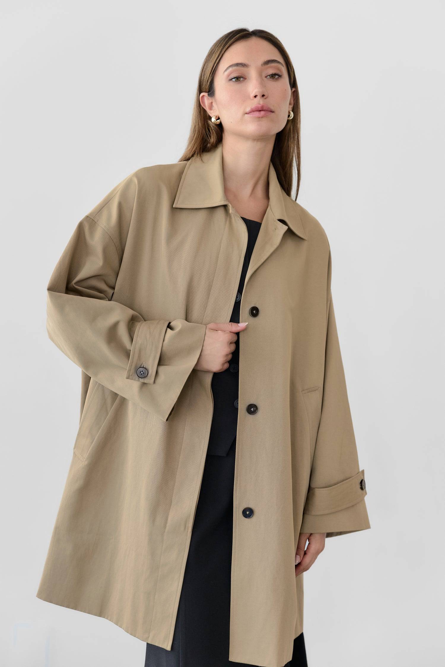 8828669198557, The Cove Coat, Outerwear, Mod Ref, attached scarf,Black,cf-color-black,cf-color-khaki,cf-size-l,cf-size-m,cf-size-s,cf-vendor-mod-ref,Coat,coat jacket,Comfort,Comfortable,Detail,Details,Fall,layer,layering,Layers,Long,Long Sleeve,modref,new,Outerwear,Oversized,Oversized Coat,Peacoat,Pockets,scarf,Spring,Summer,Transitional,Trench,Trench Coat,Womens, Information The Cove Coat offers an effortless chic style. It sits slightly below the hips for a trendy look and includes an attachable scarf for