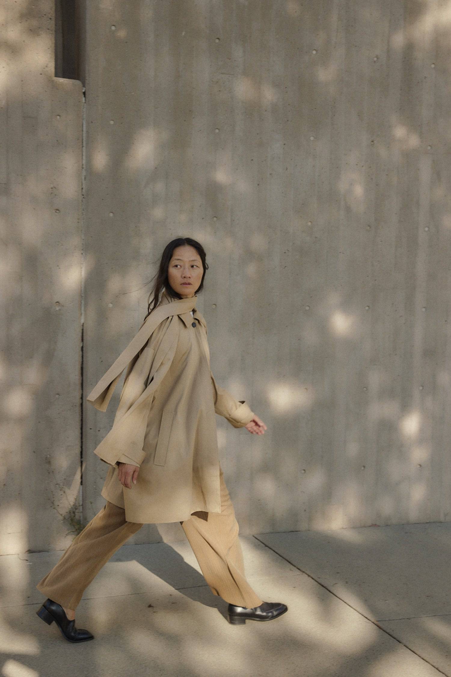 8828669198557, The Cove Coat, Outerwear, Mod Ref, attached scarf,Black,cf-color-black,cf-color-khaki,cf-size-l,cf-size-m,cf-size-s,cf-vendor-mod-ref,Coat,coat jacket,Comfort,Comfortable,Detail,Details,Fall,layer,layering,Layers,Long,Long Sleeve,modref,new,Outerwear,Oversized,Oversized Coat,Peacoat,Pockets,scarf,Spring,Summer,Transitional,Trench,Trench Coat,Womens, Information The Cove Coat offers an effortless chic style. It sits slightly below the hips for a trendy look and includes an attachable scarf for