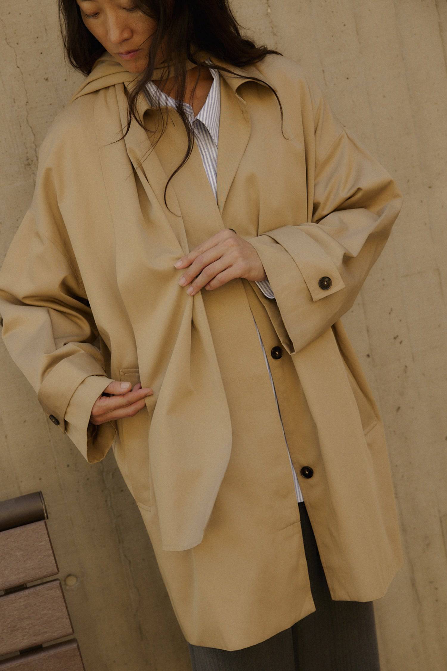 8828669198557, The Cove Coat, Outerwear, Mod Ref, attached scarf,Black,cf-color-black,cf-color-khaki,cf-size-l,cf-size-m,cf-size-s,cf-vendor-mod-ref,Coat,coat jacket,Comfort,Comfortable,Detail,Details,Fall,layer,layering,Layers,Long,Long Sleeve,modref,new,Outerwear,Oversized,Oversized Coat,Peacoat,Pockets,scarf,Spring,Summer,Transitional,Trench,Trench Coat,Womens, Information The Cove Coat offers an effortless chic style. It sits slightly below the hips for a trendy look and includes an attachable scarf for