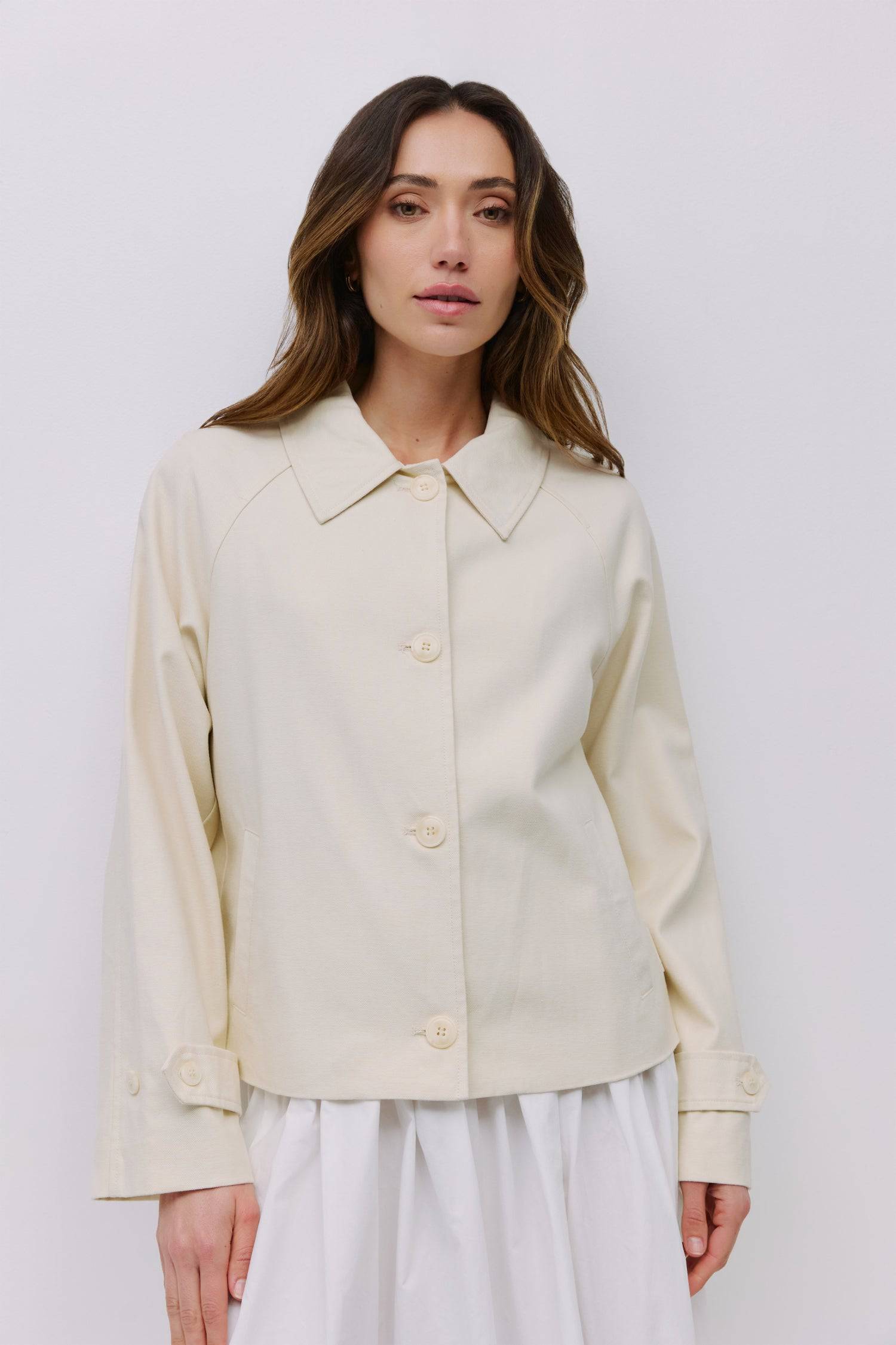 9023166251229, The Melina Jacket, Outerwear, Mod Ref, Button,Buttons,Casual,cf-color-black,cf-color-cream,cf-size-l,cf-size-m,cf-vendor-mod-ref,Collared Jacket,Comfortable,Cream,Fall,Front Pockets,Jacket,Light Jacket,Long Sleeve,modref,new,Outerwear,Pockets,Relaxed,Summer,Women's, Information The Melina Jacket is a refined take on a classic silhouette. This short trench jacket is crafted from a midweight cotton-Tencel blend for a structured yet breathable feel. Designed with raglan sleeves, adjustable butto