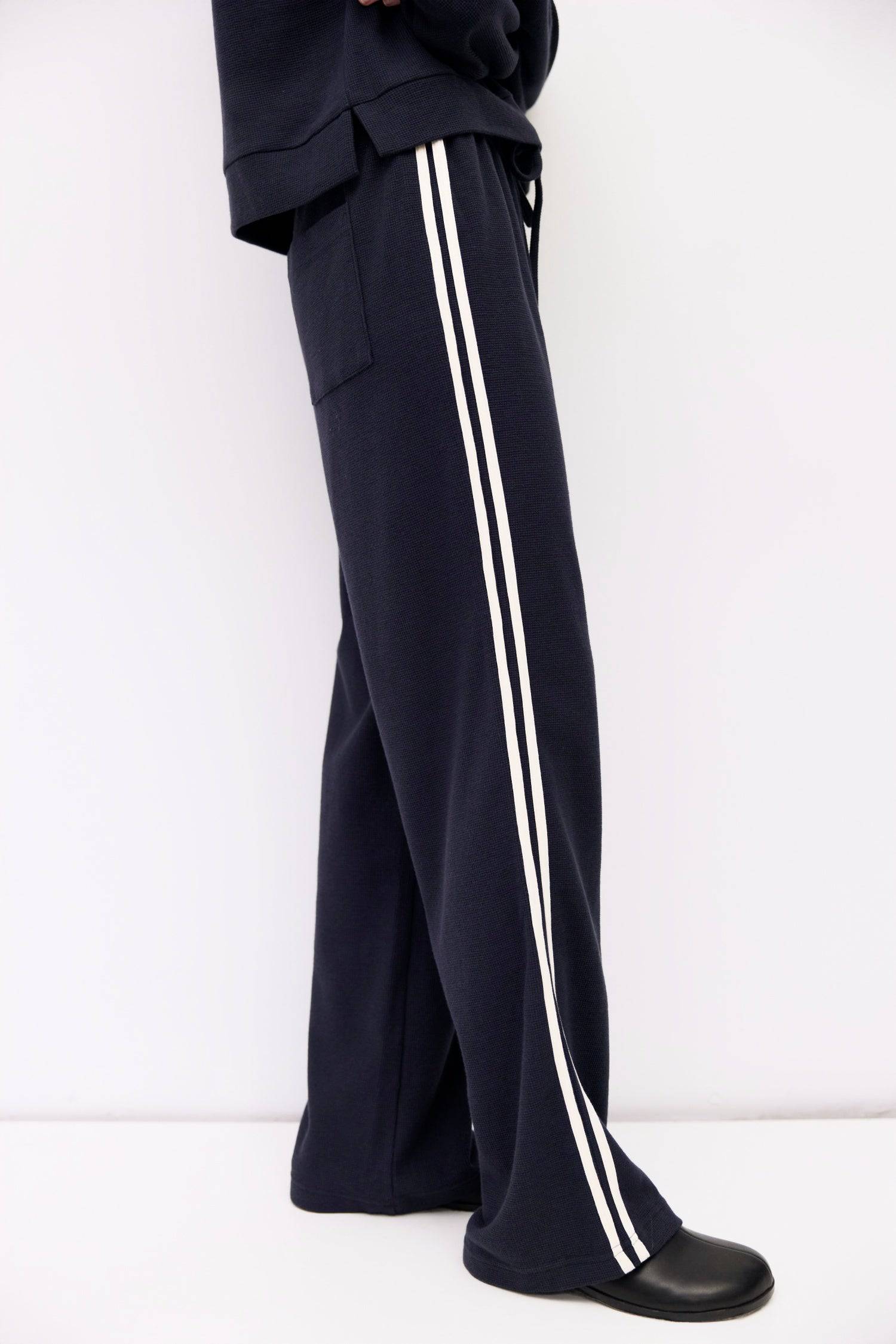 9084508078301, The Enzo Pants, Bottoms, All Row, Basic,Basics,Bottoms,brown,Casual,cf-color-brown,cf-color-navy,cf-size-l,cf-size-m,cf-size-s,cf-vendor-mod-ref,Chestnut Brown,Comfortable,dark brown,Drawstring,drawstring waist,Everyday,Long Pants,Lounge,Loungewear,mid rise,modref,Navy,Pants,Patch Pockets,Relaxed,Relaxed Fit,Sets,Spring,waffle knit,Wide Leg,Wide Leg Pants,women,Womens, Information The Enzo Pants blend sporty style with relaxed comfort, featuring a wide-leg fit and elastic drawstring waistband