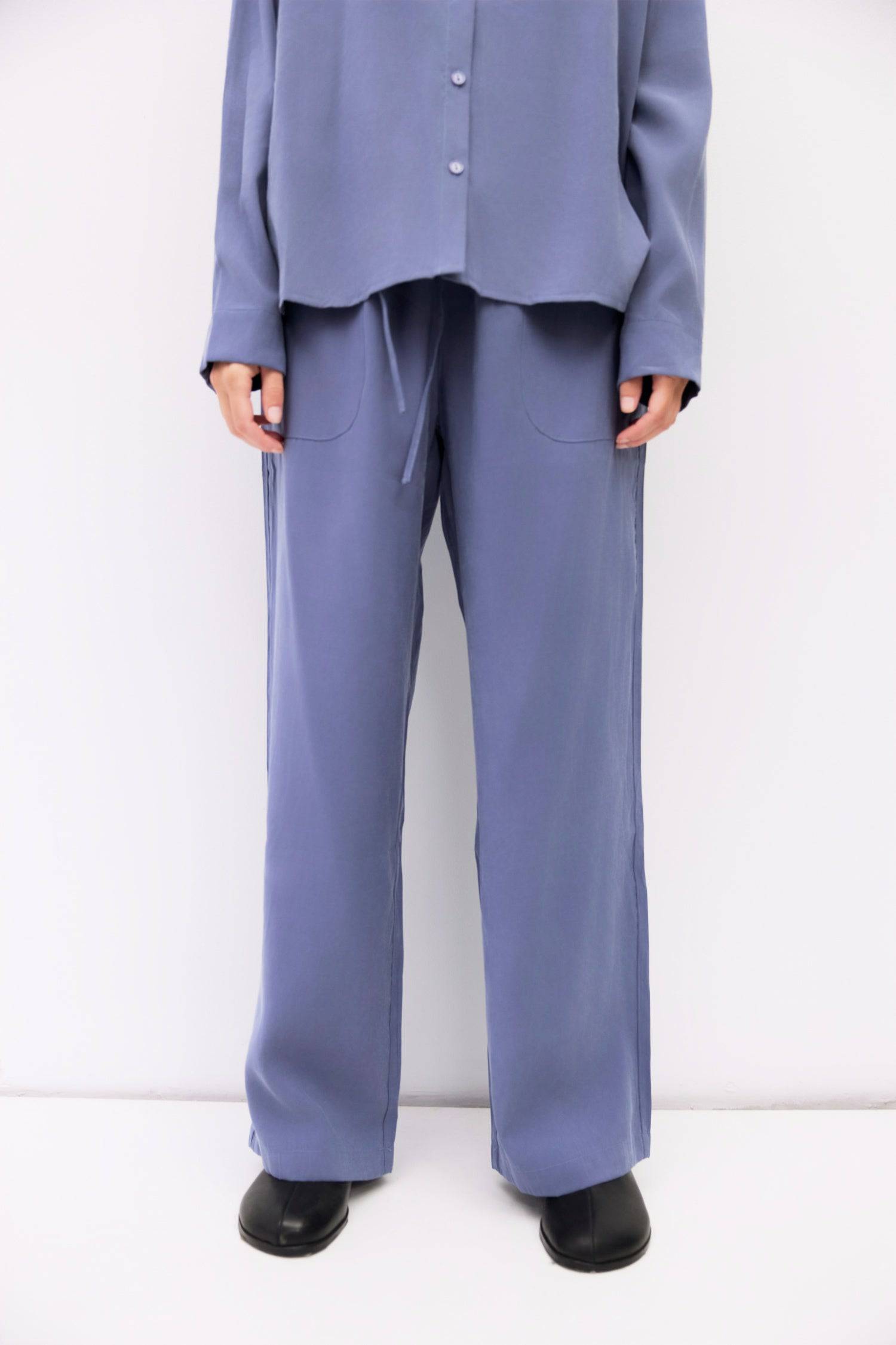 9084436185309, The Ellis Pants, Bottoms, All Row, Basic,Basics,Bottoms,Casual,cf-size-l,cf-size-m,cf-size-s,cf-vendor-mod-ref,Comfortable,Drawstring,drawstring waist,Everyday,Front Pocket,Lightweight,Long Pants,Loose,Loose Fit,mid rise,modref,Pants,Patch Pockets,Pockets,Sets,Spring,straight fit,Transitional,white,women,Womens, Information The Ellis Pants feature a loose, wide-leg fit crafted from lightweight, brushed woven fabric. The adjustable drawstring waist and front patch pockets combine comfort and s