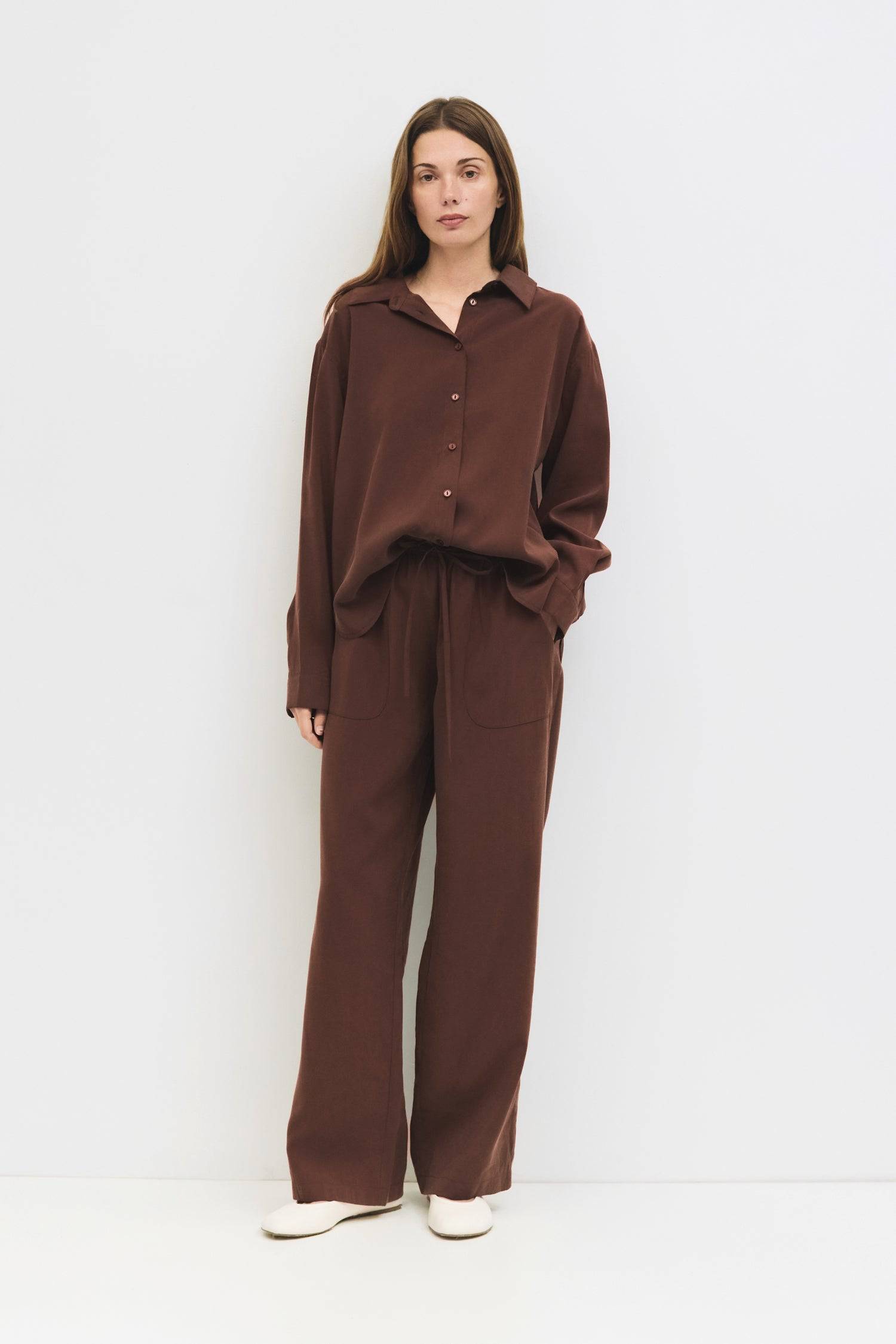 9084436185309, The Ellis Pants, Bottoms, All Row, Basic,Basics,Bottoms,Casual,cf-size-l,cf-size-m,cf-size-s,cf-vendor-mod-ref,Comfortable,Drawstring,drawstring waist,Everyday,Front Pocket,Lightweight,Long Pants,Loose,Loose Fit,mid rise,modref,Pants,Patch Pockets,Pockets,Sets,Spring,straight fit,Transitional,white,women,Womens, Information The Ellis Pants feature a loose, wide-leg fit crafted from lightweight, brushed woven fabric. The adjustable drawstring waist and front patch pockets combine comfort and s