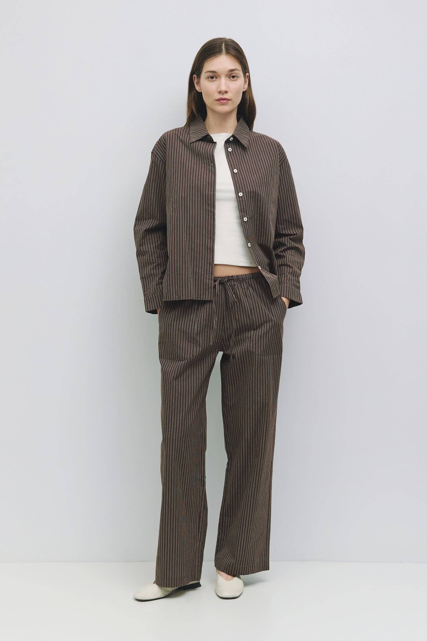 8911031107805, The Dixon Pants, Bottoms, All Row, All Row,allrow,beige,Breathable,brown,Casual,cf-color-beige,cf-color-brown,cf-size-l,cf-size-m,cf-vendor-all-row,Cotton,everyday,ivory,Khaki,Lightweight,Long Pants,Lounge,Loungewear,matching,Matching Set,new,Oversized,Pants,Pinstripes,Relaxed,Relaxed Fit,Sets,spring,Striped,Summer,Vertical Stripes,womens, Information The Dixon Pants are multi-color striped drawstring pants with a relaxed straight leg. The elasticated waist ensures a comfortable fit. Pair it