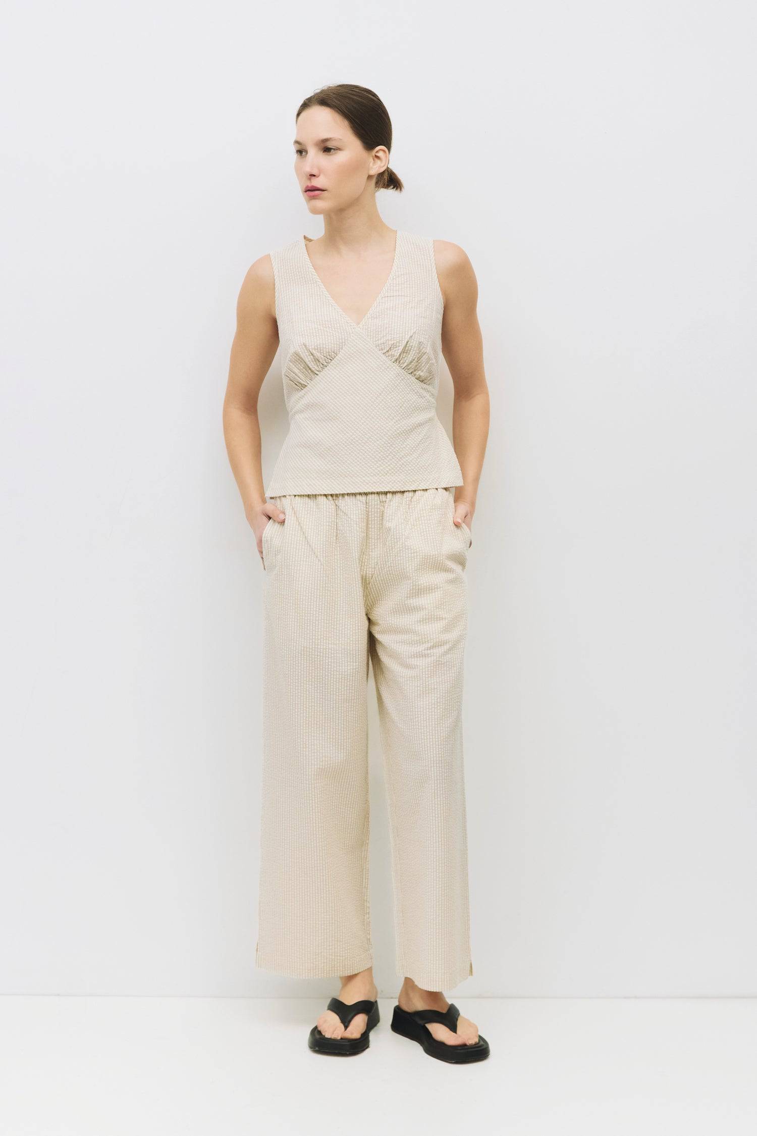 8983684088029, The Ryland Pants, Bottoms, Mod Ref, Basic,Basics,Bottoms,Casual,cf-size-l,cf-size-m,cf-size-s,cf-vendor-mod-ref,Comfortable,Everyday,Front Pocket,Long Pants,mid rise,modref,Pants,Patch Pockets,Pleated,Pockets,Sets,Spring,straight fit,Transitional,white,women,Womens, Information The Ryland Pants are relaxed-fit, seersucker pants, featuring an elasticized waistband, mid-ankle length, side pockets, a back pocket on the right side, and an inner shorts lining. Pair it with The Ryland Top (TR3866)