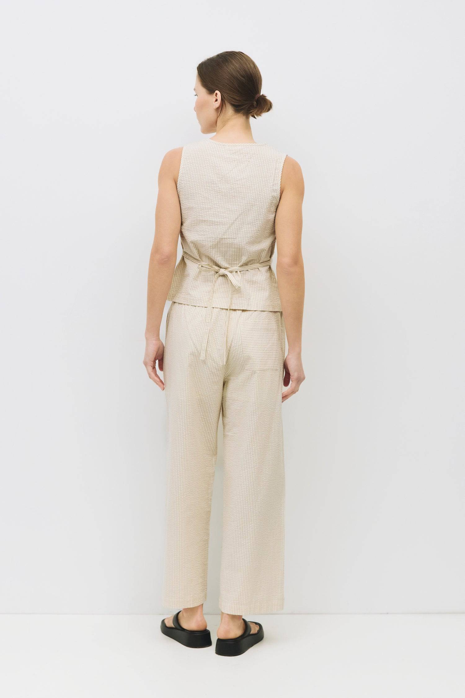 8983684088029, The Ryland Pants, Bottoms, Mod Ref, Basic,Basics,Bottoms,Casual,cf-size-l,cf-size-m,cf-size-s,cf-vendor-mod-ref,Comfortable,Everyday,Front Pocket,Long Pants,mid rise,modref,Pants,Patch Pockets,Pleated,Pockets,Sets,Spring,straight fit,Transitional,white,women,Womens, Information The Ryland Pants are relaxed-fit, seersucker pants, featuring an elasticized waistband, mid-ankle length, side pockets, a back pocket on the right side, and an inner shorts lining. Pair it with The Ryland Top (TR3866)