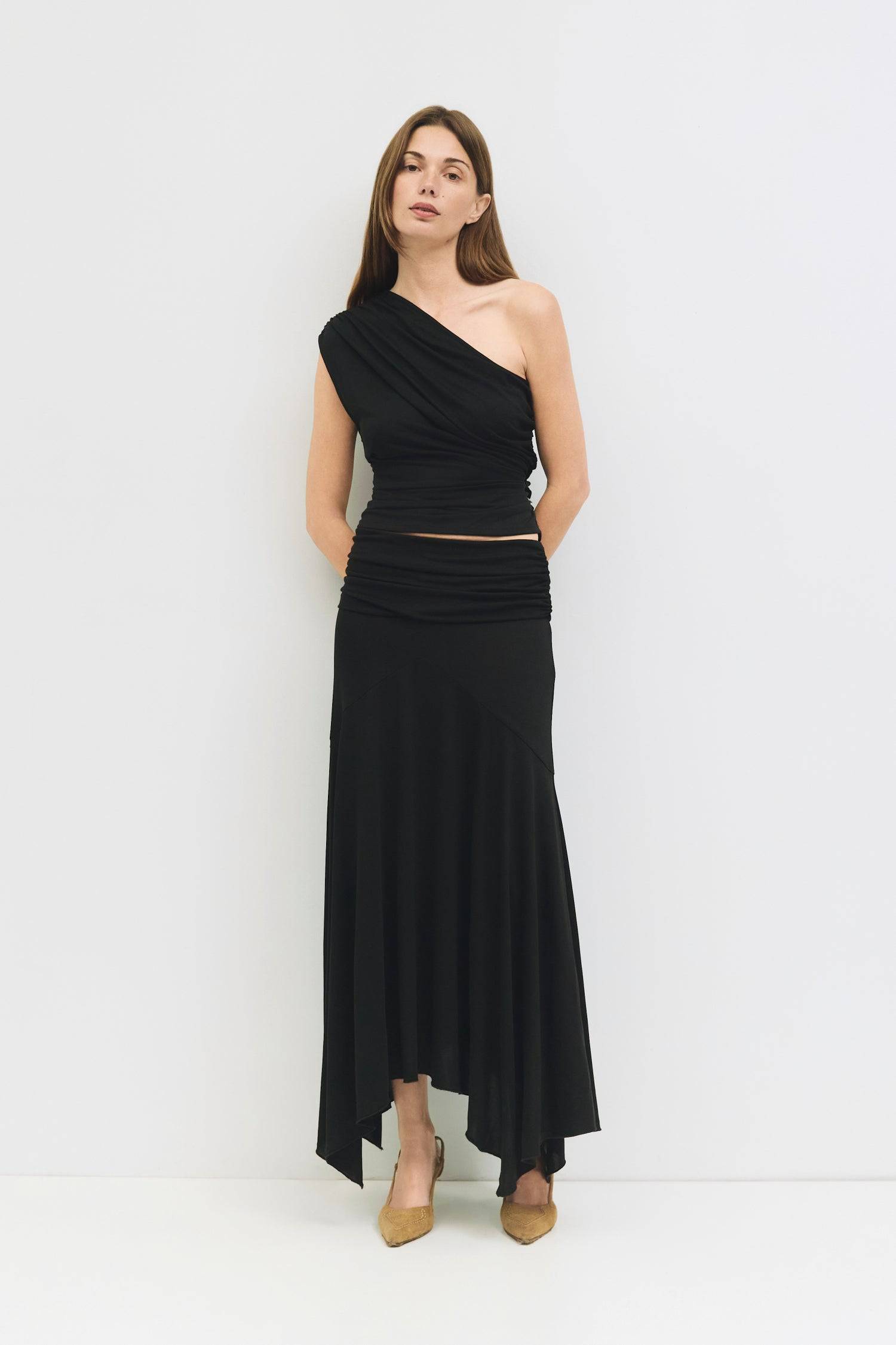 9065329950941, The Oceane Skirt, Bottoms, All Row, Black,Bottom,Bottoms,Breathable,cf-color-black,cf-color-white,cf-size-l,cf-size-m,cf-size-s,cf-vendor-all-row,Comfortable,dressy,Elastic,Elastic Waist,Elastic Waistband,Elegant,everyday,High Waist,matching,Matching Set,Maxi,maxi skirt,new,ruched,Semi-Formal,Skirt,spring,Summer,versatile,womens, Information The Oceane Skirt is designed with a softly draped handkerchief hem for effortless movement. The ruched elastic waist creates a flattering, sculpted shape