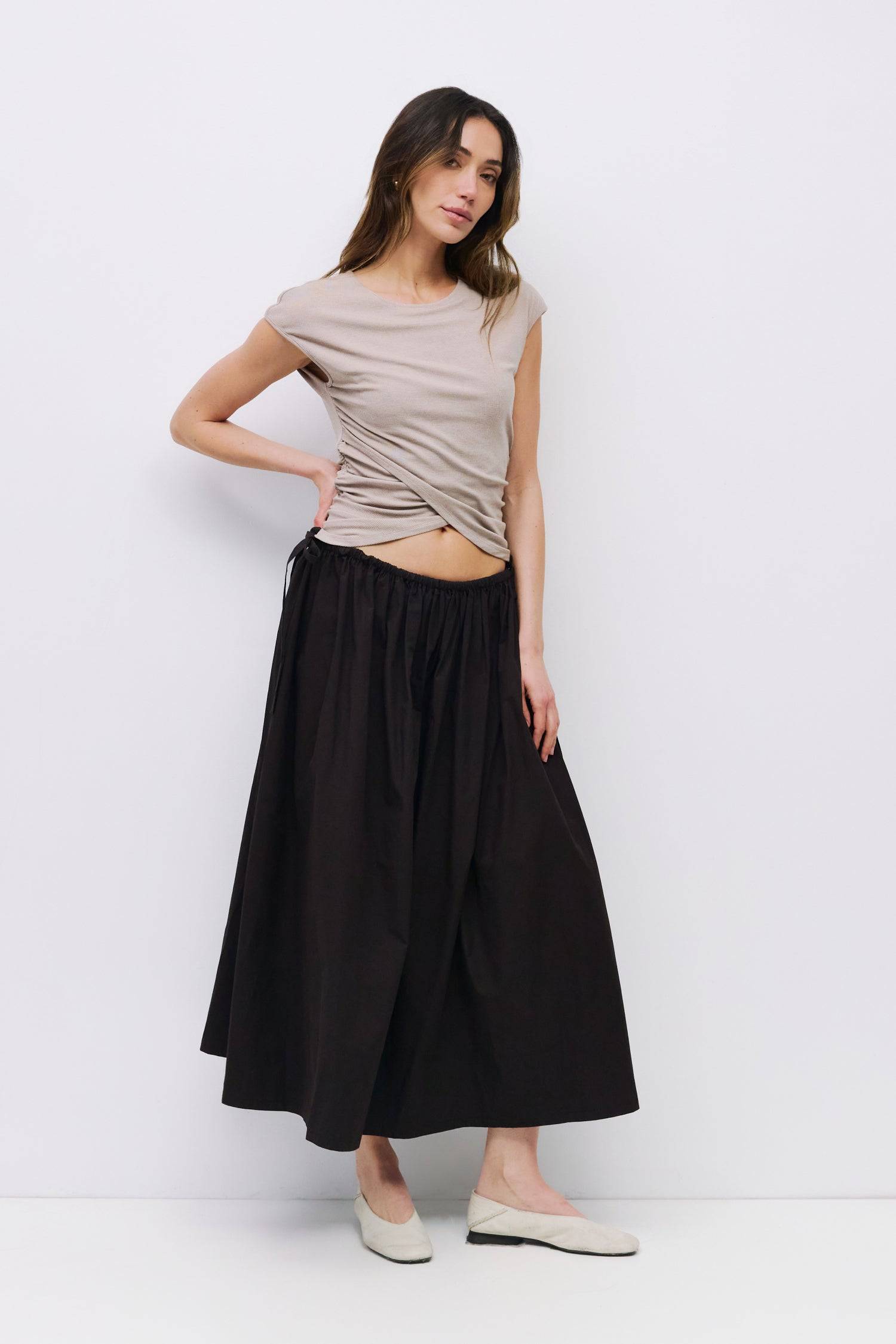 8994991636701, The Kiana Skirt, Bottoms, All Row, Black,Bottom,Bottoms,Breathable,cf-color-black,cf-color-white,cf-color-yellow,cf-size-l,cf-size-m,cf-size-s,cf-vendor-all-row,Comfortable,everyday,High Waist,Midi Skirt,new,Skirt,spring,Summer,versatile,white,womens, Information The Kiana Skirt features adjustable ties on either side of the waist for a customizable fit. Crafted from midweight fabric, it offers a flattering silhouette with a relaxed, effortless vibe. Details 100% Cotton Adjustable Side Waist