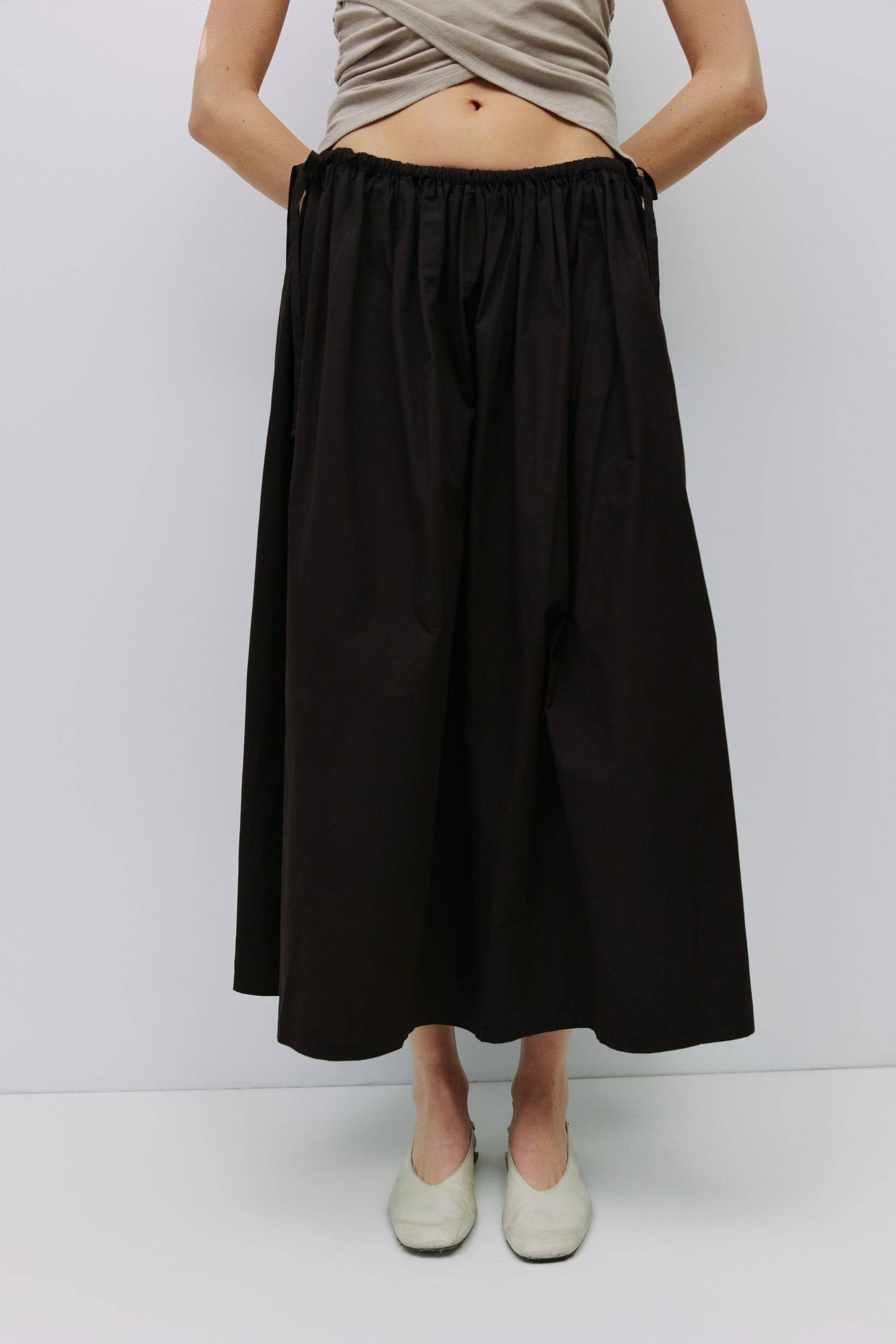 8994991636701, The Kiana Skirt, Bottoms, All Row, Black,Bottom,Bottoms,Breathable,cf-color-black,cf-color-white,cf-color-yellow,cf-size-l,cf-size-m,cf-size-s,cf-vendor-all-row,Comfortable,everyday,High Waist,Midi Skirt,new,Skirt,spring,Summer,versatile,white,womens, Information The Kiana Skirt features adjustable ties on either side of the waist for a customizable fit. Crafted from midweight fabric, it offers a flattering silhouette with a relaxed, effortless vibe. Details 100% Cotton Adjustable Side Waist