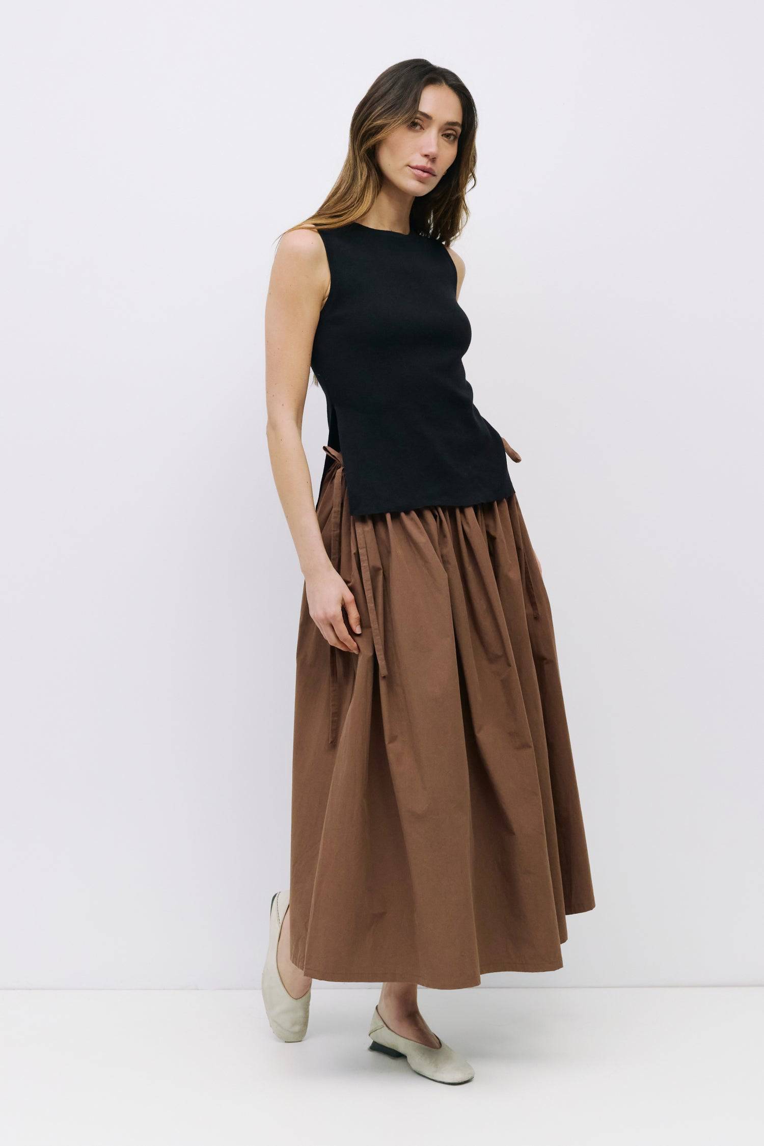 8994991636701, The Kiana Skirt, Bottoms, All Row, Black,Bottom,Bottoms,Breathable,cf-color-black,cf-color-white,cf-color-yellow,cf-size-l,cf-size-m,cf-size-s,cf-vendor-all-row,Comfortable,everyday,High Waist,Midi Skirt,new,Skirt,spring,Summer,versatile,white,womens, Information The Kiana Skirt features adjustable ties on either side of the waist for a customizable fit. Crafted from midweight fabric, it offers a flattering silhouette with a relaxed, effortless vibe. Details 100% Cotton Adjustable Side Waist