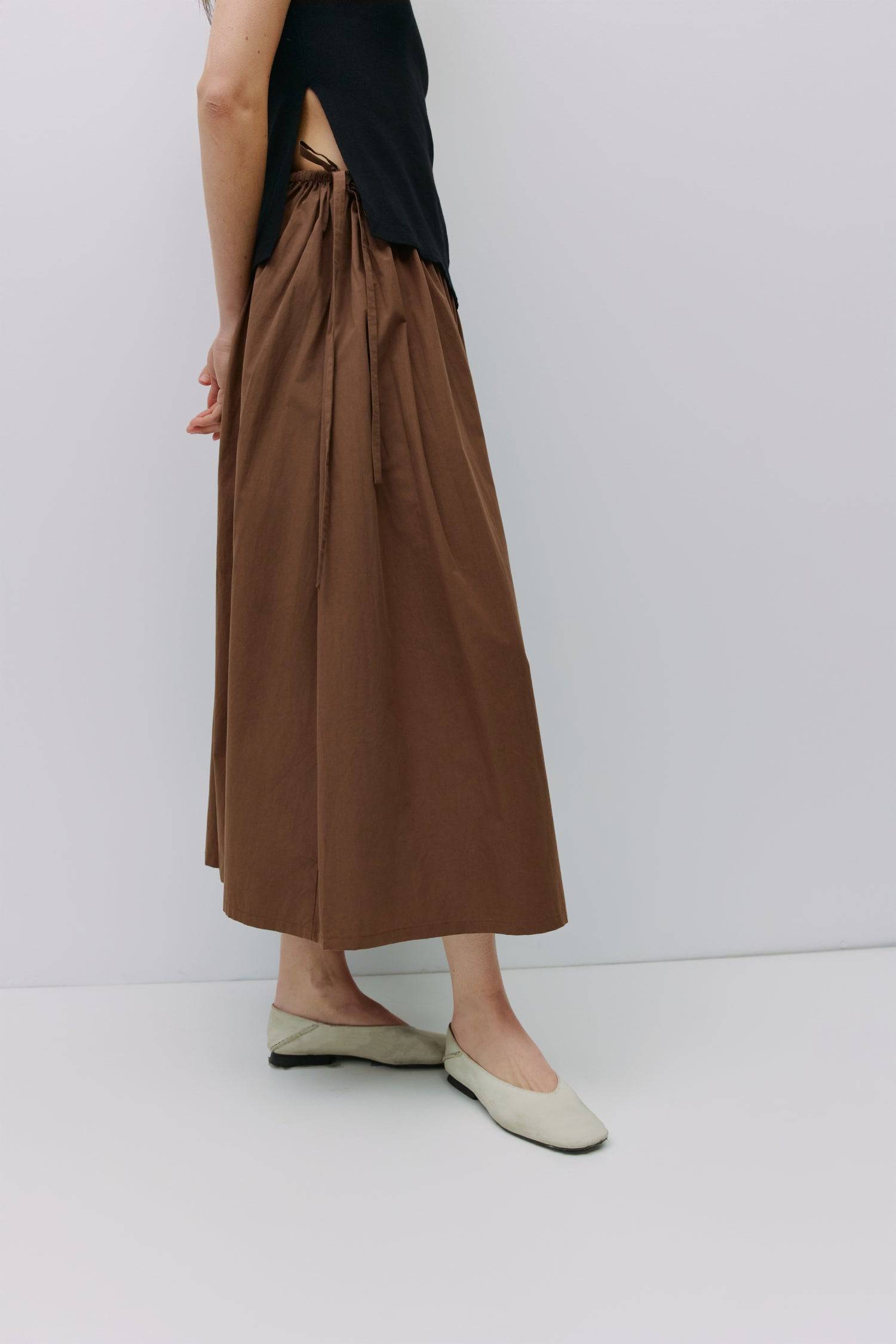 8994991636701, The Kiana Skirt, Bottoms, All Row, Black,Bottom,Bottoms,Breathable,cf-color-black,cf-color-white,cf-color-yellow,cf-size-l,cf-size-m,cf-size-s,cf-vendor-all-row,Comfortable,everyday,High Waist,Midi Skirt,new,Skirt,spring,Summer,versatile,white,womens, Information The Kiana Skirt features adjustable ties on either side of the waist for a customizable fit. Crafted from midweight fabric, it offers a flattering silhouette with a relaxed, effortless vibe. Details 100% Cotton Adjustable Side Waist