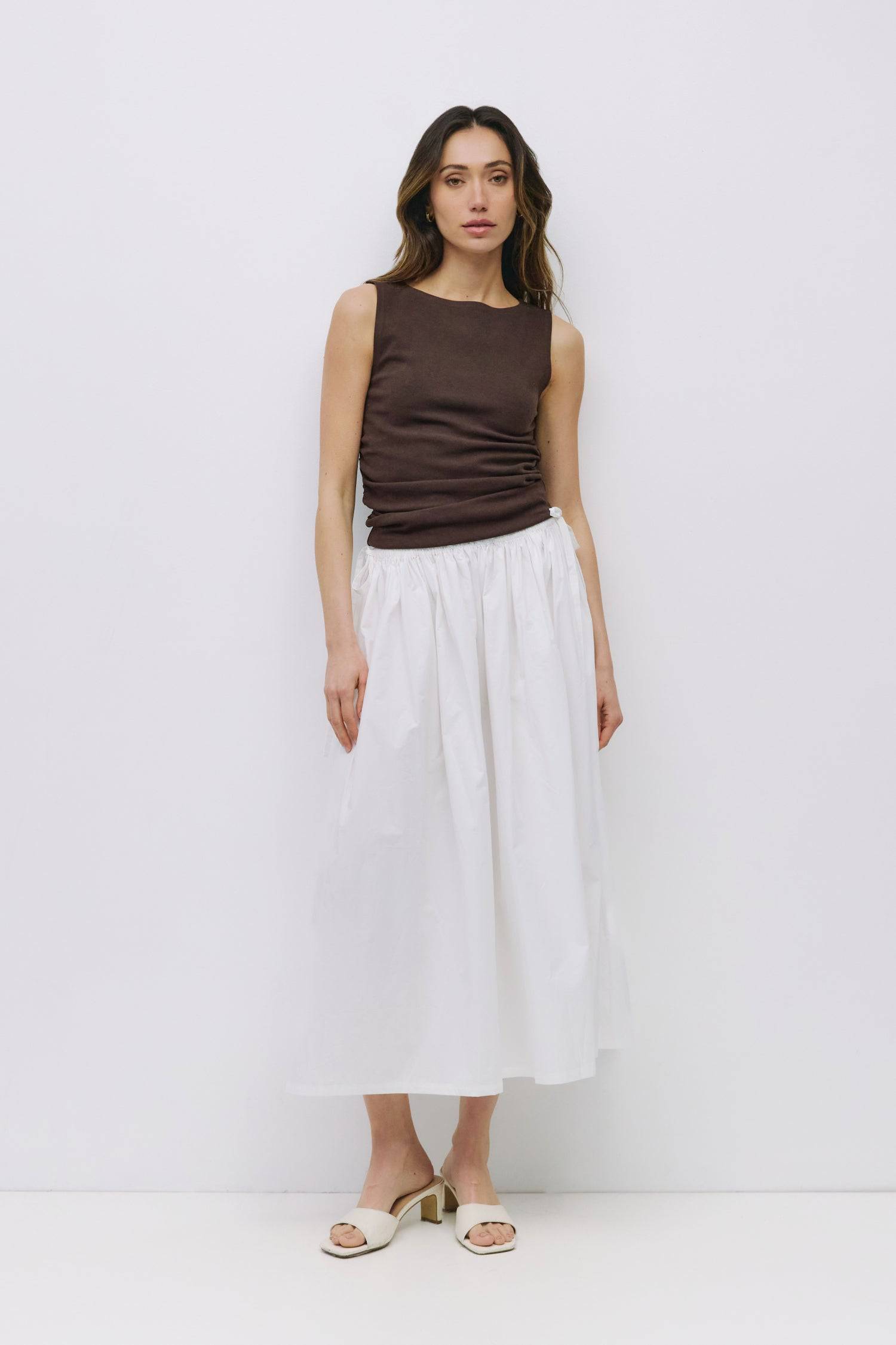 8994991636701, The Kiana Skirt, Bottoms, All Row, Black,Bottom,Bottoms,Breathable,cf-color-black,cf-color-white,cf-color-yellow,cf-size-l,cf-size-m,cf-size-s,cf-vendor-all-row,Comfortable,everyday,High Waist,Midi Skirt,new,Skirt,spring,Summer,versatile,white,womens, Information The Kiana Skirt features adjustable ties on either side of the waist for a customizable fit. Crafted from midweight fabric, it offers a flattering silhouette with a relaxed, effortless vibe. Details 100% Cotton Adjustable Side Waist