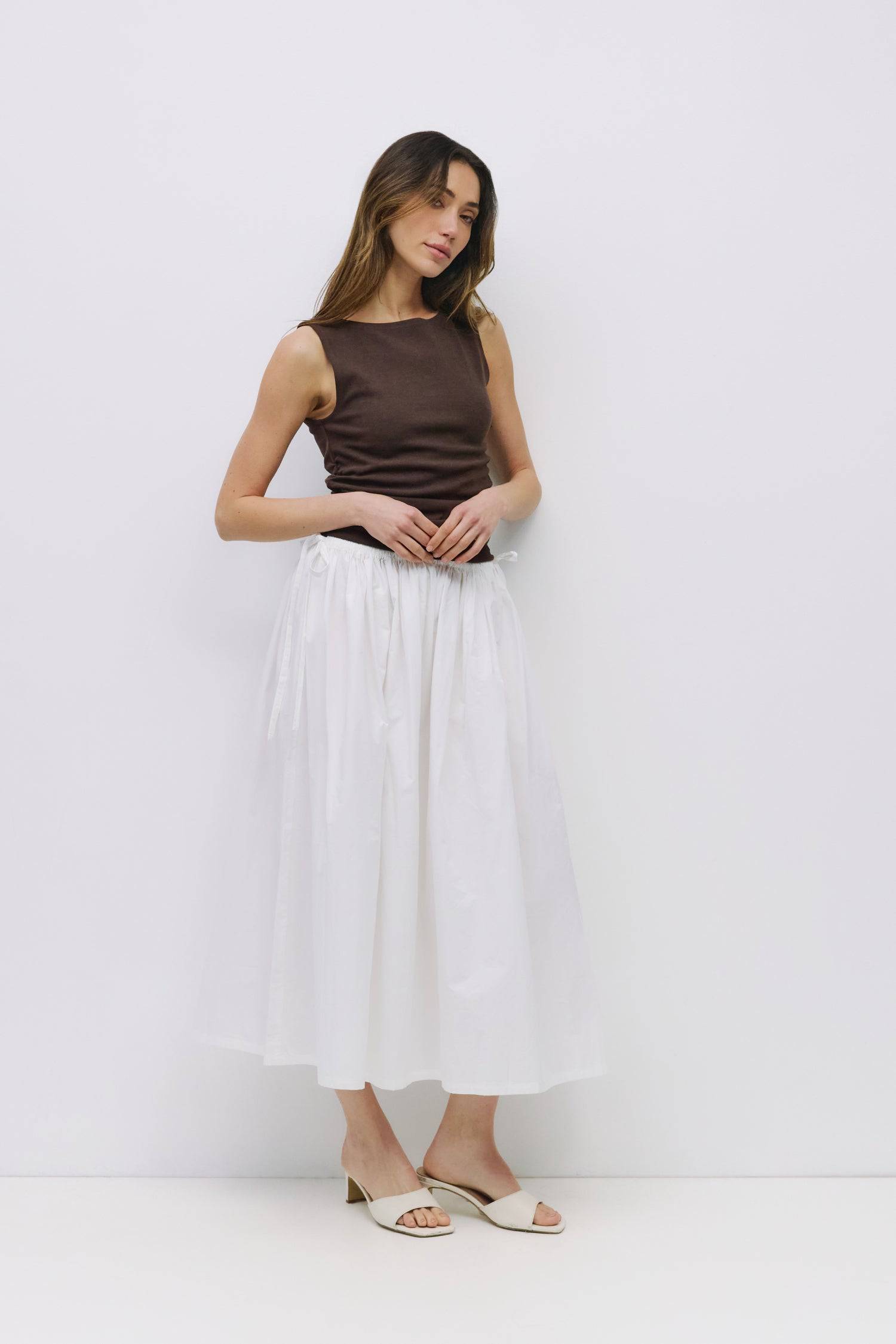 8994991636701, The Kiana Skirt, Bottoms, All Row, Black,Bottom,Bottoms,Breathable,cf-color-black,cf-color-white,cf-color-yellow,cf-size-l,cf-size-m,cf-size-s,cf-vendor-all-row,Comfortable,everyday,High Waist,Midi Skirt,new,Skirt,spring,Summer,versatile,white,womens, Information The Kiana Skirt features adjustable ties on either side of the waist for a customizable fit. Crafted from midweight fabric, it offers a flattering silhouette with a relaxed, effortless vibe. Details 100% Cotton Adjustable Side Waist