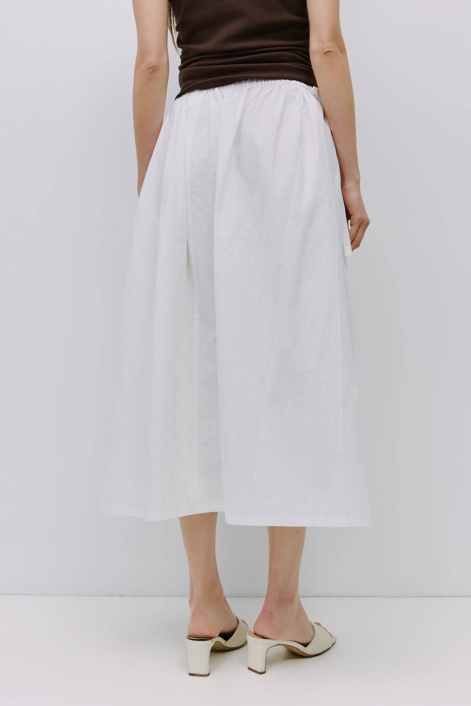 8994991636701, The Kiana Skirt, Bottoms, All Row, Black,Bottom,Bottoms,Breathable,cf-color-black,cf-color-white,cf-color-yellow,cf-size-l,cf-size-m,cf-size-s,cf-vendor-all-row,Comfortable,everyday,High Waist,Midi Skirt,new,Skirt,spring,Summer,versatile,white,womens, Information The Kiana Skirt features adjustable ties on either side of the waist for a customizable fit. Crafted from midweight fabric, it offers a flattering silhouette with a relaxed, effortless vibe. Details 100% Cotton Adjustable Side Waist