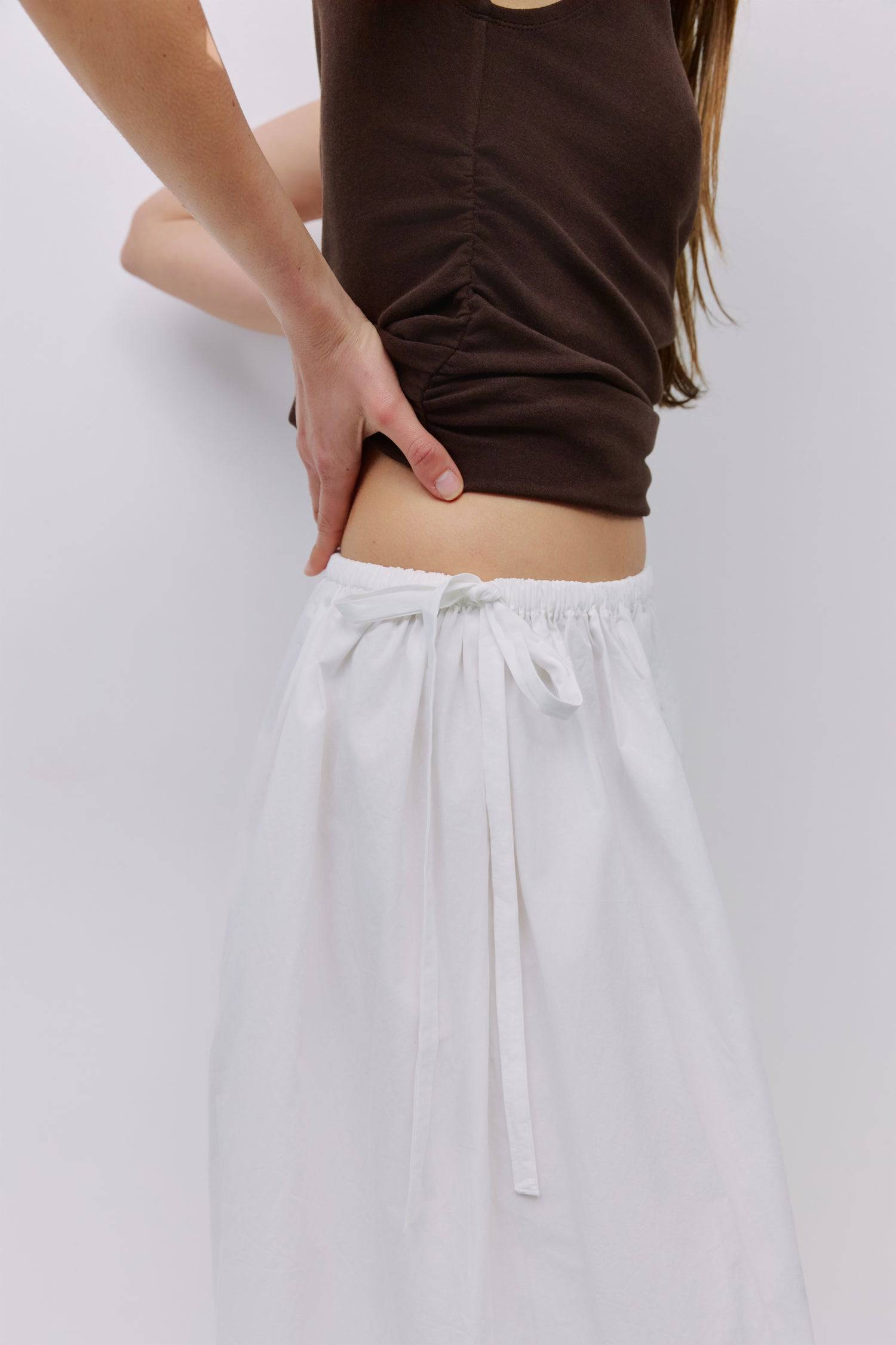 8994991636701, The Kiana Skirt, Bottoms, All Row, Black,Bottom,Bottoms,Breathable,cf-color-black,cf-color-white,cf-color-yellow,cf-size-l,cf-size-m,cf-size-s,cf-vendor-all-row,Comfortable,everyday,High Waist,Midi Skirt,new,Skirt,spring,Summer,versatile,white,womens, Information The Kiana Skirt features adjustable ties on either side of the waist for a customizable fit. Crafted from midweight fabric, it offers a flattering silhouette with a relaxed, effortless vibe. Details 100% Cotton Adjustable Side Waist