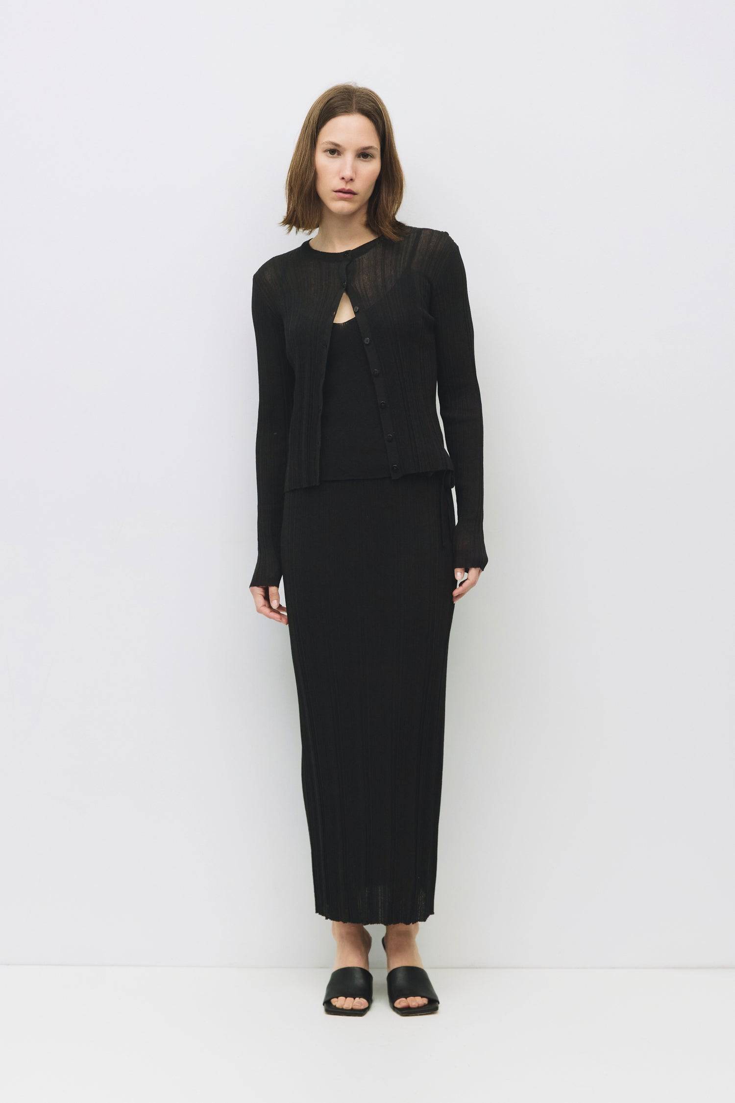 8954054770909, The Trinity Skirt, Dress, Mod Ref, Black,Bottom,Bottoms,Casual,cf-color-black,cf-color-cream,cf-size-l,cf-size-m,cf-size-s,cf-vendor-mod-ref,Comfortable,Cotton,Cream,curve skirt,drawstring waist,Dress,Everyday,Form Fitting,Linen,linen-blend,maxi skirt,Midi Dress,midi length,new,Rib Knit,Ribbed,Sleeveless,Spring,Summer,womens, Information The Trinity Skirt combines sheer ribbed knitting with a satin lining for a sleek, comfortable fit that moves with you. With a hidden side zipper and hook-and