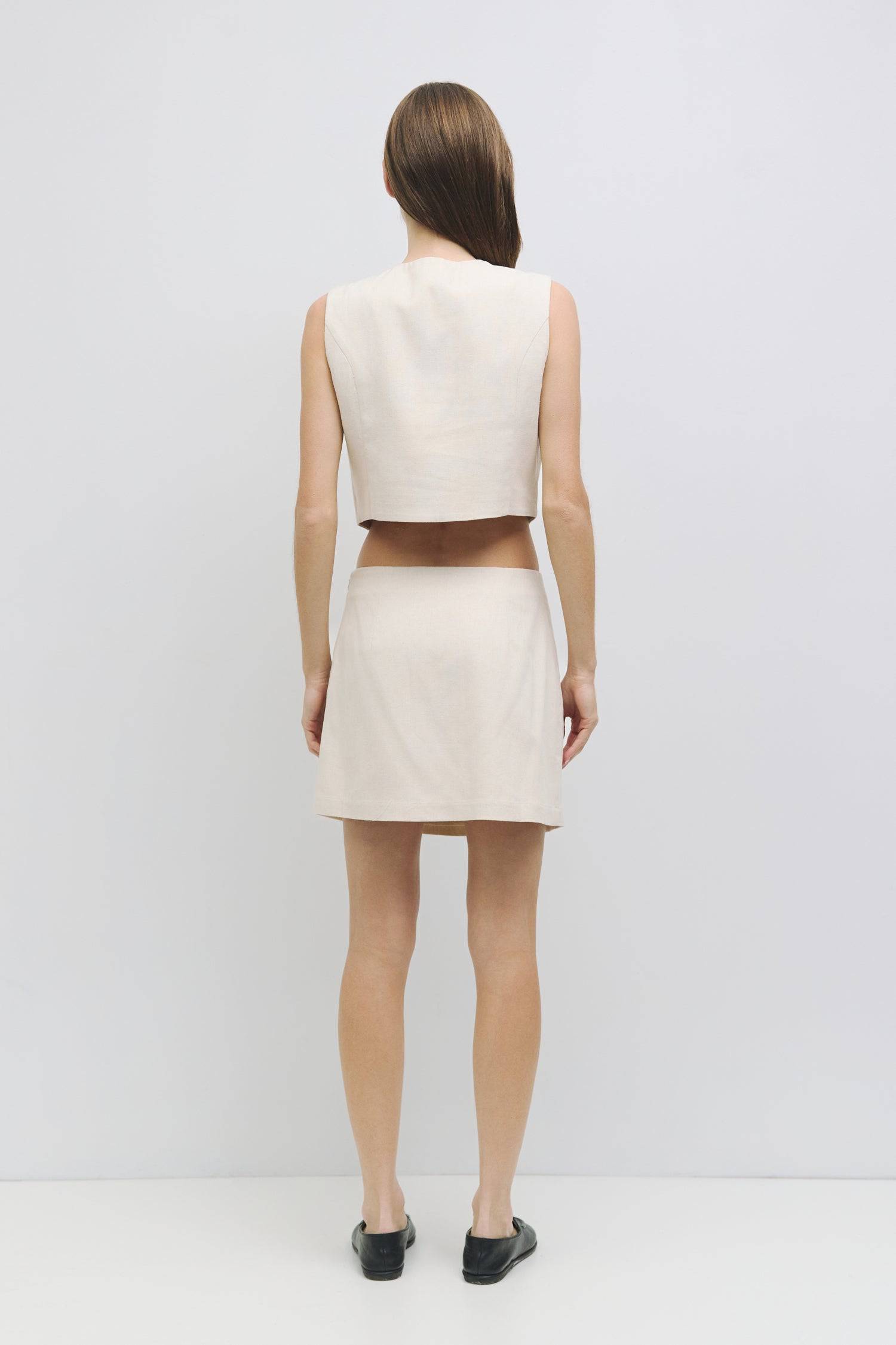 8954053951709, The Sterling Skirt, Bottoms, Mod Ref, adjustable,Black,Casual,cf-color-black,cf-color-oatmeal,cf-size-l,cf-size-m,cf-size-s,cf-size-xl,cf-size-xs,cf-vendor-all-row,cotton,Everyday,new,Oatmeal,Pocket,Pockets,Relaxed,Relaxed Fit,set,Sets,Skirt,Women's, Information The Sterling Skirt is a chic mini-length piece designed for a fitted silhouette, featuring dart details for a flattering fit. With a hidden side zipper with a hook-and-eye closure and a fully lined interior, this skirt pairs perfectly