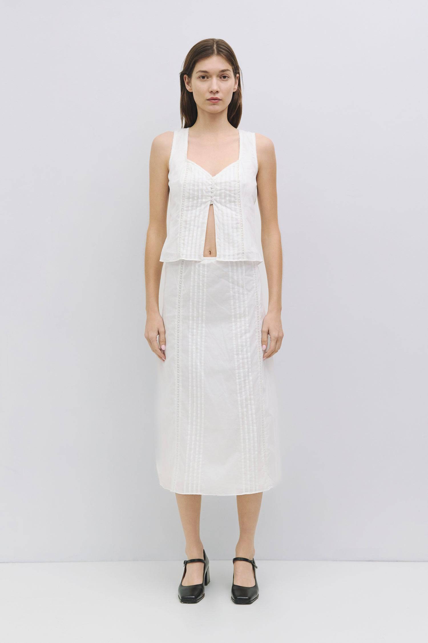 8954054181085, The Finley Skirt, Bottoms, Mod Ref, adjustable,allrow,cf-color-white,cf-size-l,cf-size-m,cf-size-s,cf-size-xl,cf-size-xs,cf-vendor-all-row,cotton,Everyday,Midi,midi length,Midi Skirt,new,set,Sets,Skirt,Spring,Summer,white,Women's, Information The Finley Skirt is a cotton midi skirt with front pleat and lace inset details for a subtle touch of texture. It is a fully lined piece with a hidden side zipper complemented by a hook-and-eye closure. Style it with The Finely Top (TR3890) for an easy y