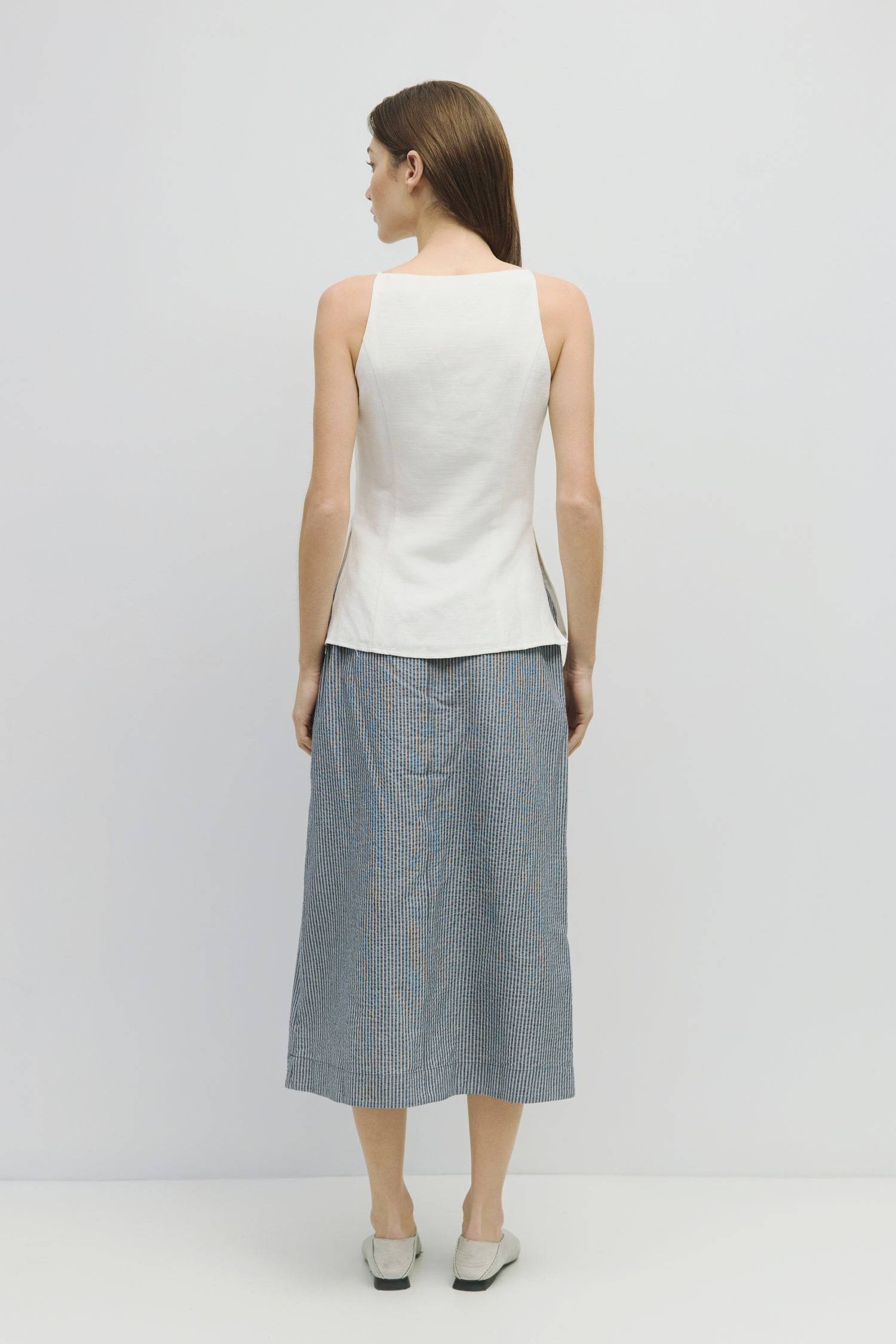 8929228947677, The Genevieve Skirt, Bottoms, Mod Ref, adjustable,Adjustable Cords,Casual,cf-size-l,cf-size-m,cf-size-s,cf-size-xl,cf-size-xs,Comfortable,cotton,Everyday,final-sale,finalsale,Maxi,midi length,Midi Skirt,new,Pinstripes,Pocket,Pockets,Relaxed,Relaxed Fit,sale,seersucker,side pockets,Skirt,Striped,texture,Women's, Information The Genevieve Skirt is a midi-length skirt designed with a lightweight seersucker fabric, featuring an elasticized waistband and front tie for a comfortable fit. With a str