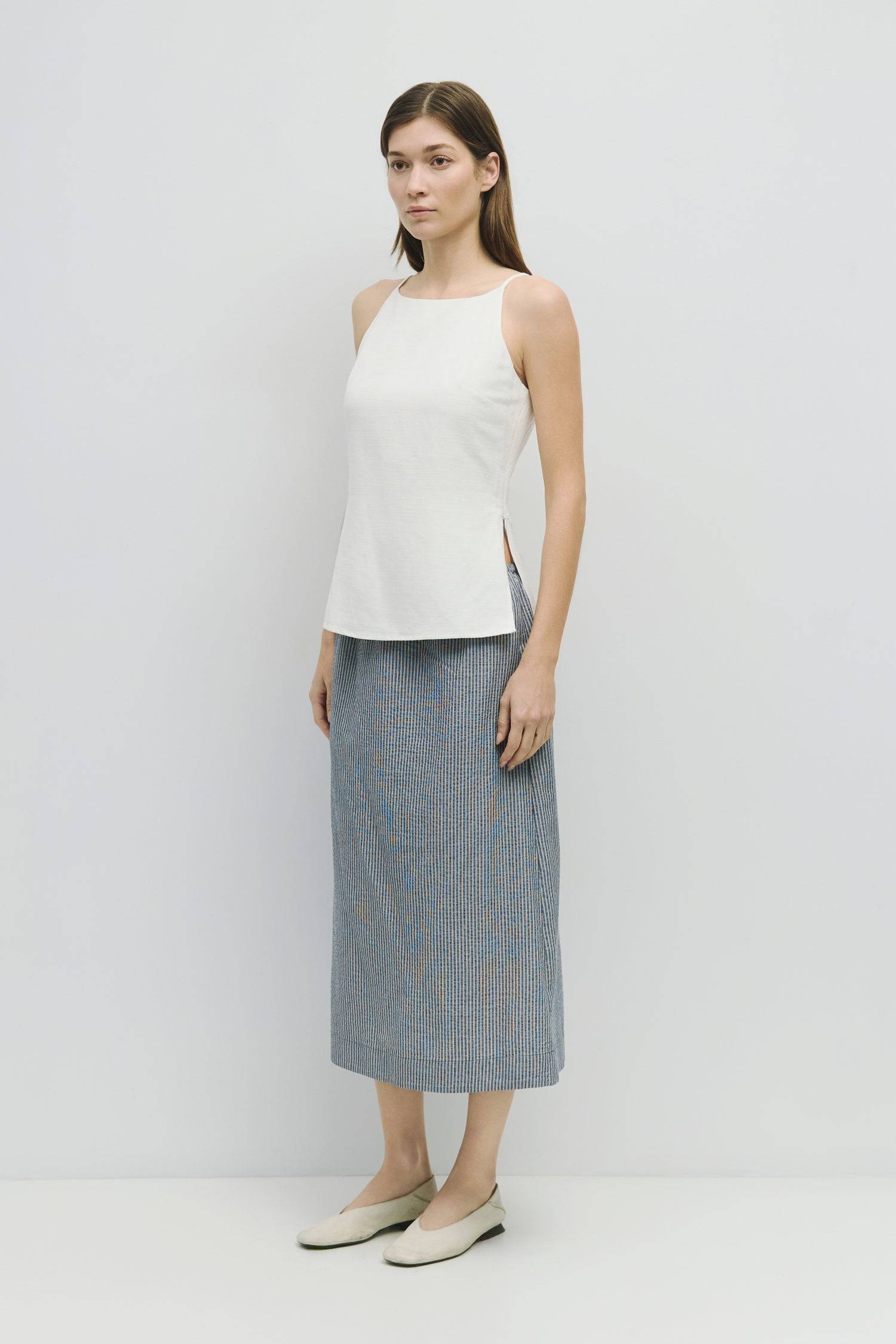 8929228947677, The Genevieve Skirt, Bottoms, Mod Ref, adjustable,Adjustable Cords,Casual,cf-size-l,cf-size-m,cf-size-s,cf-size-xl,cf-size-xs,Comfortable,cotton,Everyday,final-sale,finalsale,Maxi,midi length,Midi Skirt,new,Pinstripes,Pocket,Pockets,Relaxed,Relaxed Fit,sale,seersucker,side pockets,Skirt,Striped,texture,Women's, Information The Genevieve Skirt is a midi-length skirt designed with a lightweight seersucker fabric, featuring an elasticized waistband and front tie for a comfortable fit. With a str