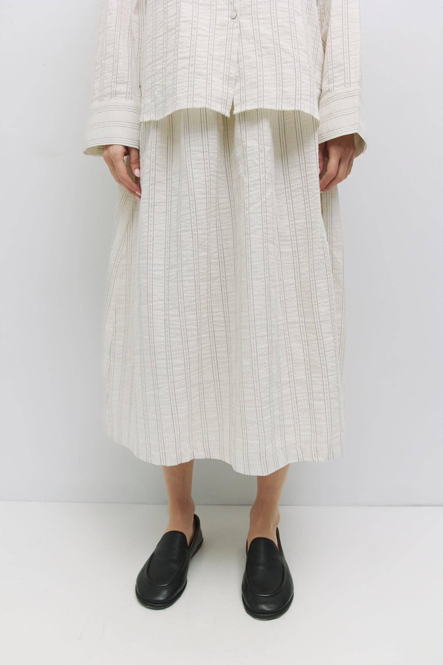 8983748542685, The Joanne Skirt, Bottoms, Mod Ref, Black,Bottom,Bottoms,Casual,cf-color-black,cf-color-cream,cf-size-l,cf-size-m,cf-size-s,cf-vendor-mod-ref,Comfortable,Cotton,Cream,curve skirt,drawstring waist,Dress,Everyday,Form Fitting,Linen,linen-blend,maxi skirt,Midi Dress,midi length,new,Rib Knit,Ribbed,Sleeveless,Spring,Summer,womens, Information The Joanne Skirt is a lightweight linen-cotton midi skirt featuring a classic striped design and curved elastic waistband for a flattering fit. With a conce