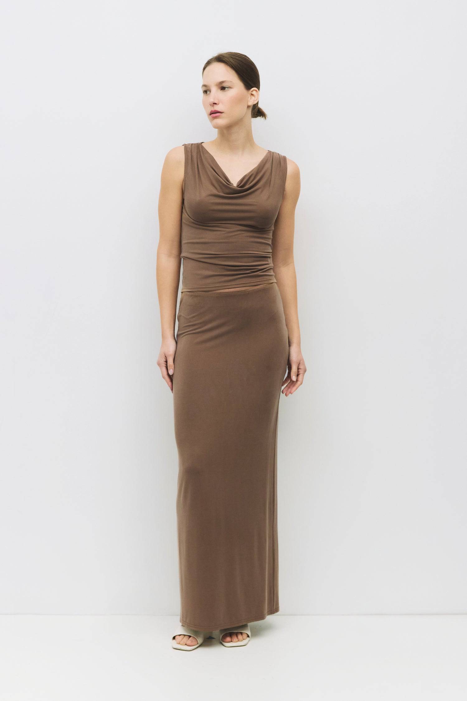 8983730487517, The Amal Skirt, Bottoms, Mod Ref, Black,Bottom,Bottoms,Casual,cf-color-black,cf-color-cream,cf-size-l,cf-size-m,cf-size-s,cf-vendor-mod-ref,Comfortable,Cotton,Cream,curve skirt,drawstring waist,Dress,Everyday,Form Fitting,Linen,linen-blend,maxi skirt,Midi Dress,midi length,new,Rib Knit,Ribbed,Sleeveless,Spring,Summer,womens, Information The Amal Skirt is a fitted, pull-on modal knit maxi skirt with a straight silhouette and a back vent for ease of movement. With an elasticized waistband and b