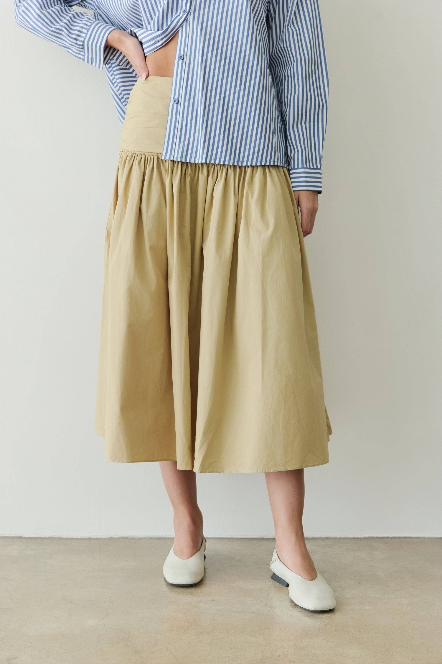 8302393393373, The Mariana Skirt, Bottoms, All Row, beige,Black,Bottom,Bottoms,Breathable,cf-color-black,cf-color-white,cf-size-l,cf-size-m,cf-size-s,cf-vendor-all-row,Comfortable,everyday,flowy,High Waist,Lime,Matching Set,Midi Skirt,POPLIN,Relaxed Fit,ruched,ruching,Semi-Formal,set,Sets,Skirt,spring,Summer,versatile,white,womens, Information The Mariana Skirt is an elevated midi skirt with wrap detailing at the waistline. It features a full, flowing design and an invisible back zipper for a seamless finis