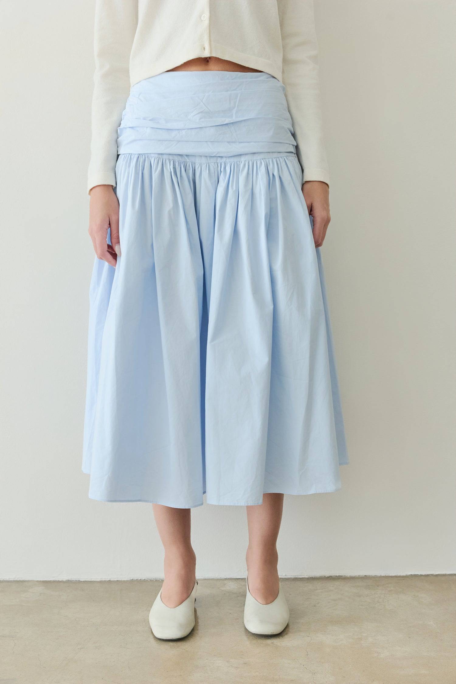 8302393393373, The Mariana Skirt, Bottoms, All Row, beige,Black,Bottom,Bottoms,Breathable,cf-color-black,cf-color-white,cf-size-l,cf-size-m,cf-size-s,cf-vendor-all-row,Comfortable,everyday,flowy,High Waist,Lime,Matching Set,Midi Skirt,POPLIN,Relaxed Fit,ruched,ruching,Semi-Formal,set,Sets,Skirt,spring,Summer,versatile,white,womens, Information The Mariana Skirt is an elevated midi skirt with wrap detailing at the waistline. It features a full, flowing design and an invisible back zipper for a seamless finis