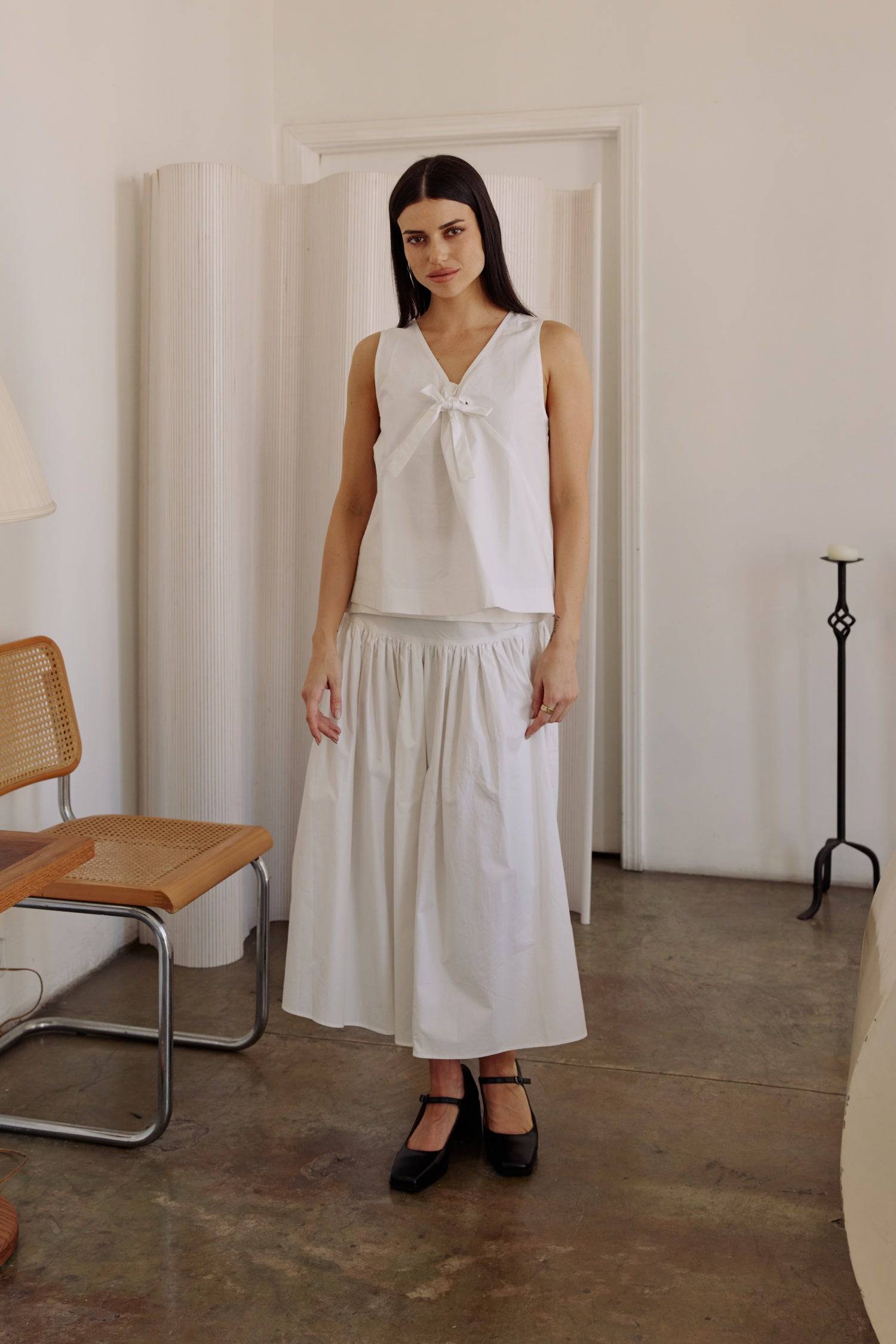 8302393393373, The Mariana Skirt, Bottoms, All Row, beige,Black,Bottom,Bottoms,Breathable,cf-color-black,cf-color-white,cf-size-l,cf-size-m,cf-size-s,cf-vendor-all-row,Comfortable,everyday,flowy,High Waist,Lime,Matching Set,Midi Skirt,POPLIN,Relaxed Fit,ruched,ruching,Semi-Formal,set,Sets,Skirt,spring,Summer,versatile,white,womens, Information The Mariana Skirt is an elevated midi skirt with wrap detailing at the waistline. It features a full, flowing design and an invisible back zipper for a seamless finis