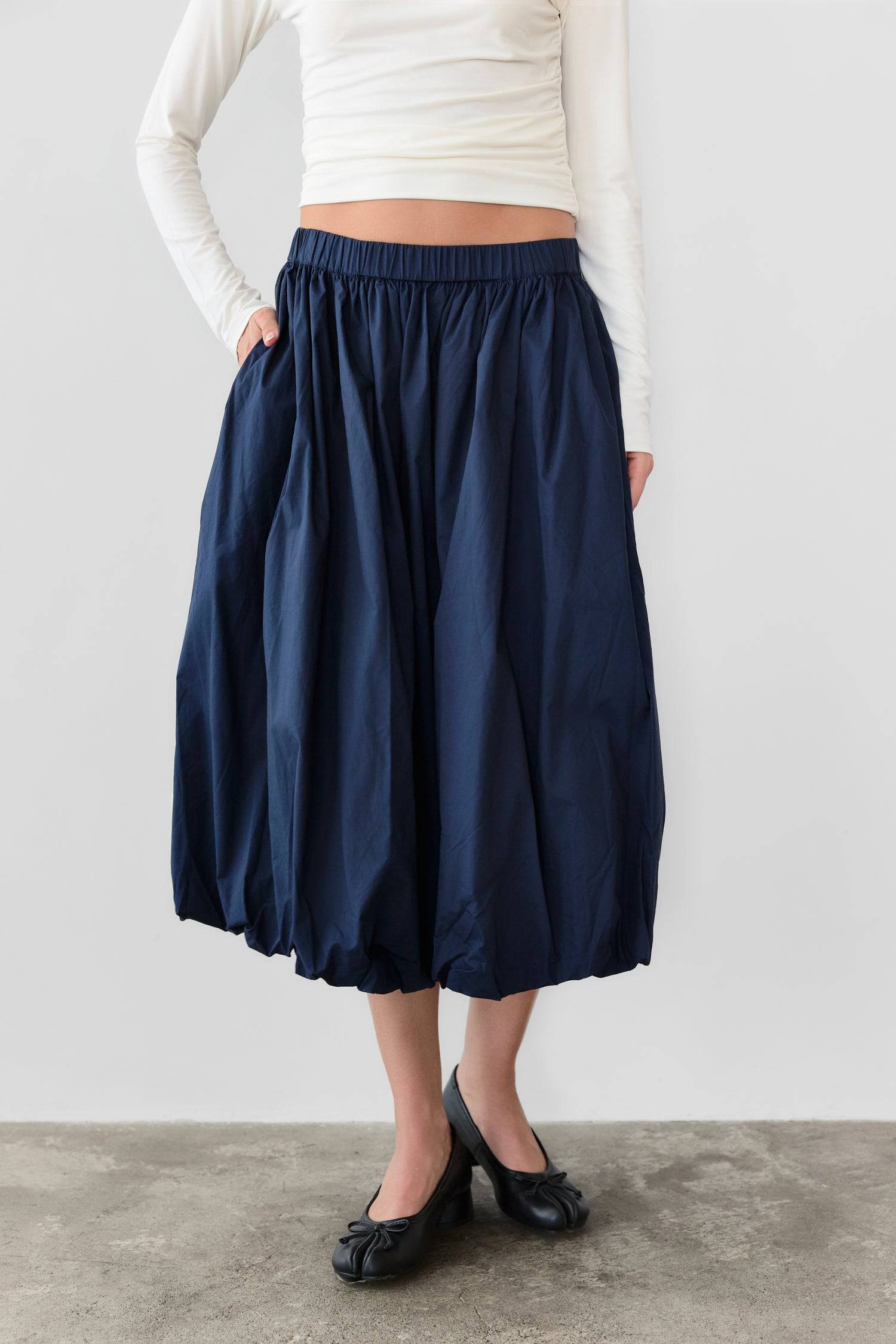 8466464997597, The Bella Skirt, Skirt, All Row, Black,Blue,Bottom,Bottoms,bubble,bubble skirt,cf-color-black,cf-color-natural,cf-size-l,cf-size-m,cf-size-s,Comfortable,Elastic,Elastic Waistband,everyday,flowy,ivory,Light Blue,matching,Midi Skirt,Mod Ref,Skirt,skirts,spring,Summer,womens, Information The Bella Skirt is a playful midi-length bubble skirt. It features an elasticated waist for a comfortable and adjustable fit. The length and bubble effect hem add volume and movement to the silhouette. Pair this