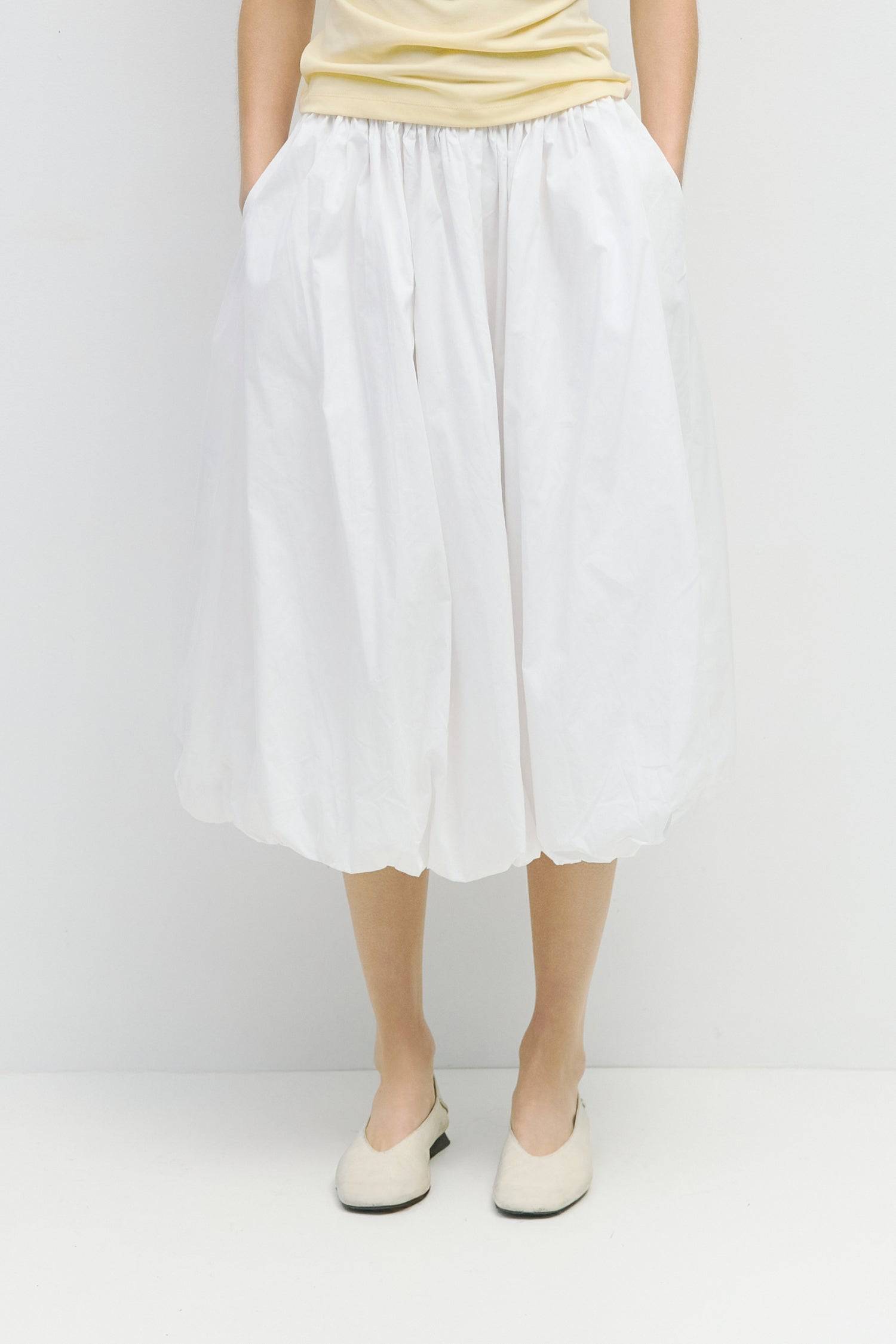 8466464997597, The Bella Skirt, Skirt, All Row, Black,Blue,Bottom,Bottoms,bubble,bubble skirt,cf-color-black,cf-color-natural,cf-size-l,cf-size-m,cf-size-s,Comfortable,Elastic,Elastic Waistband,everyday,flowy,ivory,Light Blue,matching,Midi Skirt,Mod Ref,Skirt,skirts,spring,Summer,womens, Information The Bella Skirt is a playful midi-length bubble skirt. It features an elasticated waist for a comfortable and adjustable fit. The length and bubble effect hem add volume and movement to the silhouette. Pair this