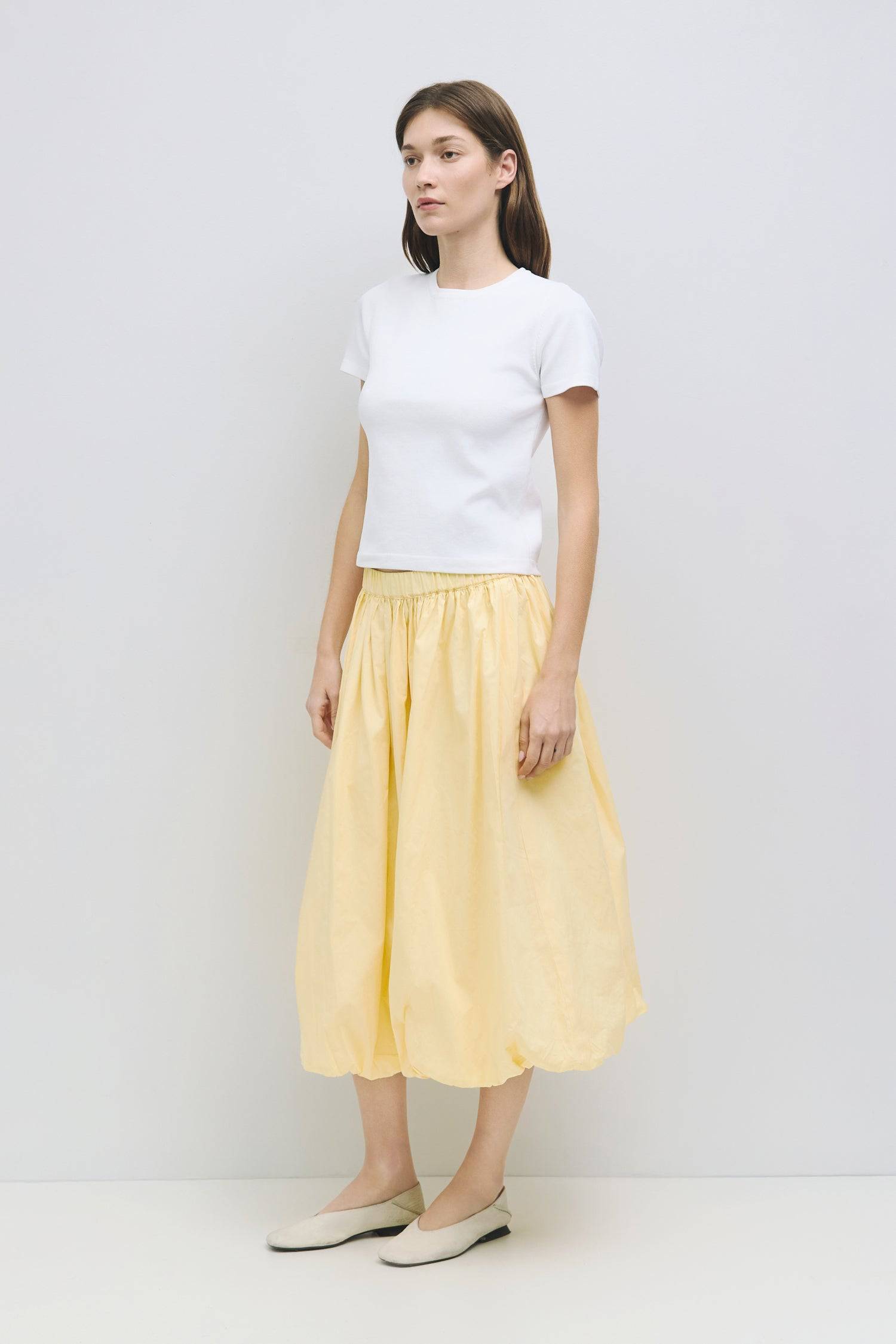 8466464997597, The Bella Skirt, Skirt, All Row, Black,Blue,Bottom,Bottoms,bubble,bubble skirt,cf-color-black,cf-color-natural,cf-size-l,cf-size-m,cf-size-s,Comfortable,Elastic,Elastic Waistband,everyday,flowy,ivory,Light Blue,matching,Midi Skirt,Mod Ref,Skirt,skirts,spring,Summer,womens, Information The Bella Skirt is a playful midi-length bubble skirt. It features an elasticated waist for a comfortable and adjustable fit. The length and bubble effect hem add volume and movement to the silhouette. Pair this