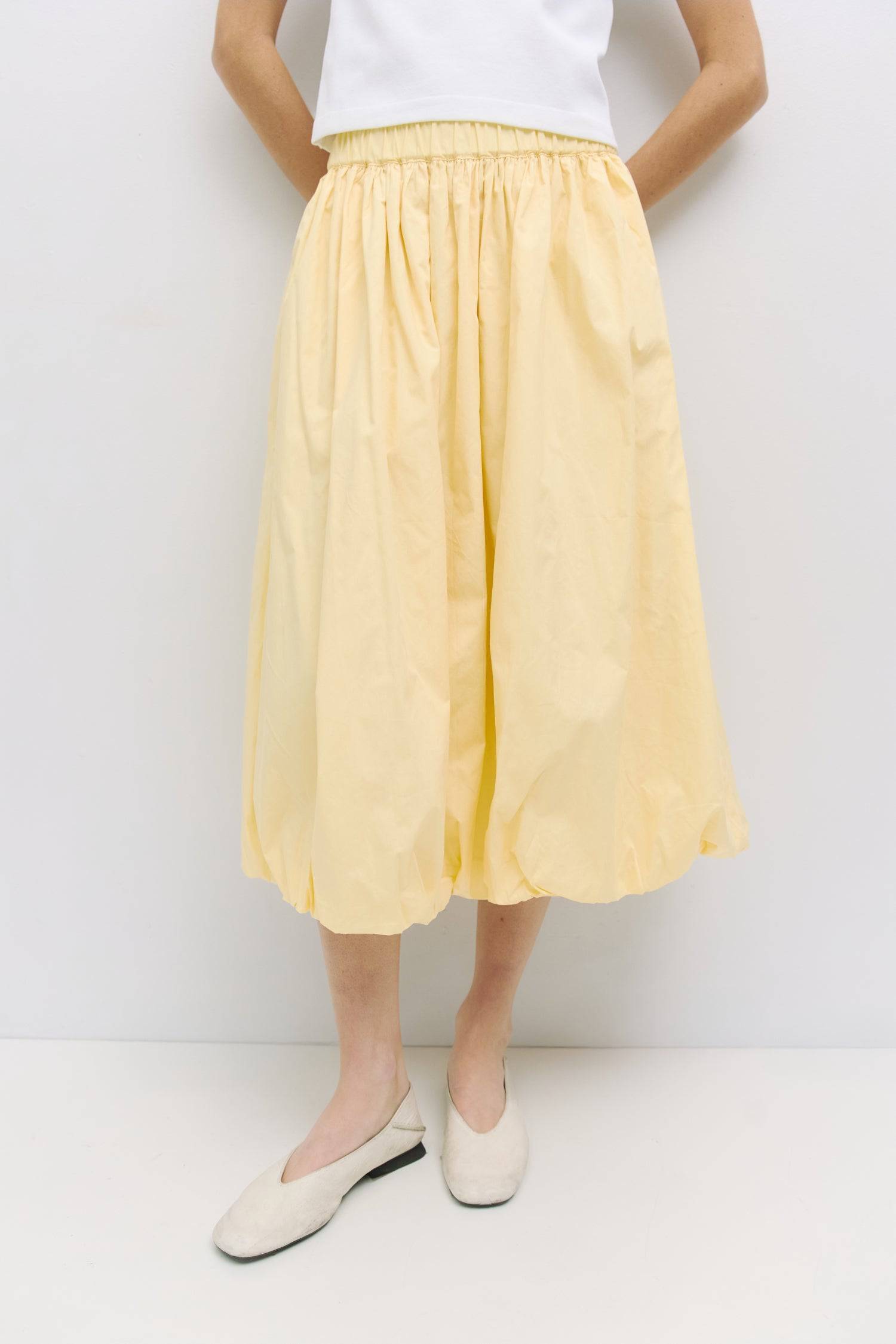 8466464997597, The Bella Skirt, Skirt, All Row, Black,Blue,Bottom,Bottoms,bubble,bubble skirt,cf-color-black,cf-color-natural,cf-size-l,cf-size-m,cf-size-s,Comfortable,Elastic,Elastic Waistband,everyday,flowy,ivory,Light Blue,matching,Midi Skirt,Mod Ref,Skirt,skirts,spring,Summer,womens, Information The Bella Skirt is a playful midi-length bubble skirt. It features an elasticated waist for a comfortable and adjustable fit. The length and bubble effect hem add volume and movement to the silhouette. Pair this