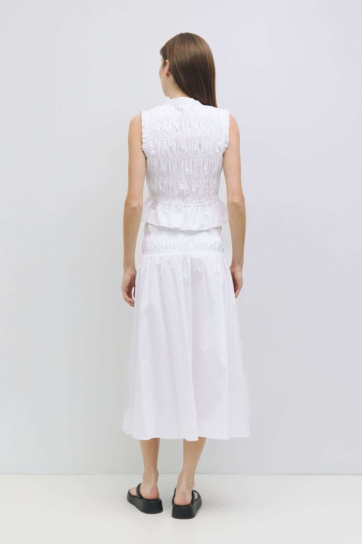 8929245167837, The Natasha Skirt, Bottoms, All Row, Black,Bottom,Bottoms,Breathable,cf-color-black,cf-color-white,cf-color-yellow,cf-size-l,cf-size-m,cf-size-s,cf-vendor-all-row,Comfortable,everyday,flowy,High Waist,Lime,Matching Set,Midi Skirt,new,POPLIN,Relaxed Fit,ruched,ruching,Semi-Formal,set,Sets,Skirt,spring,Summer,versatile,white,womens,Yellow, Information The Natasha Skirt is a comfortable midi-length skirt featuring a triple elasticized waistband and stylish paneled shirring detail at the waistlin