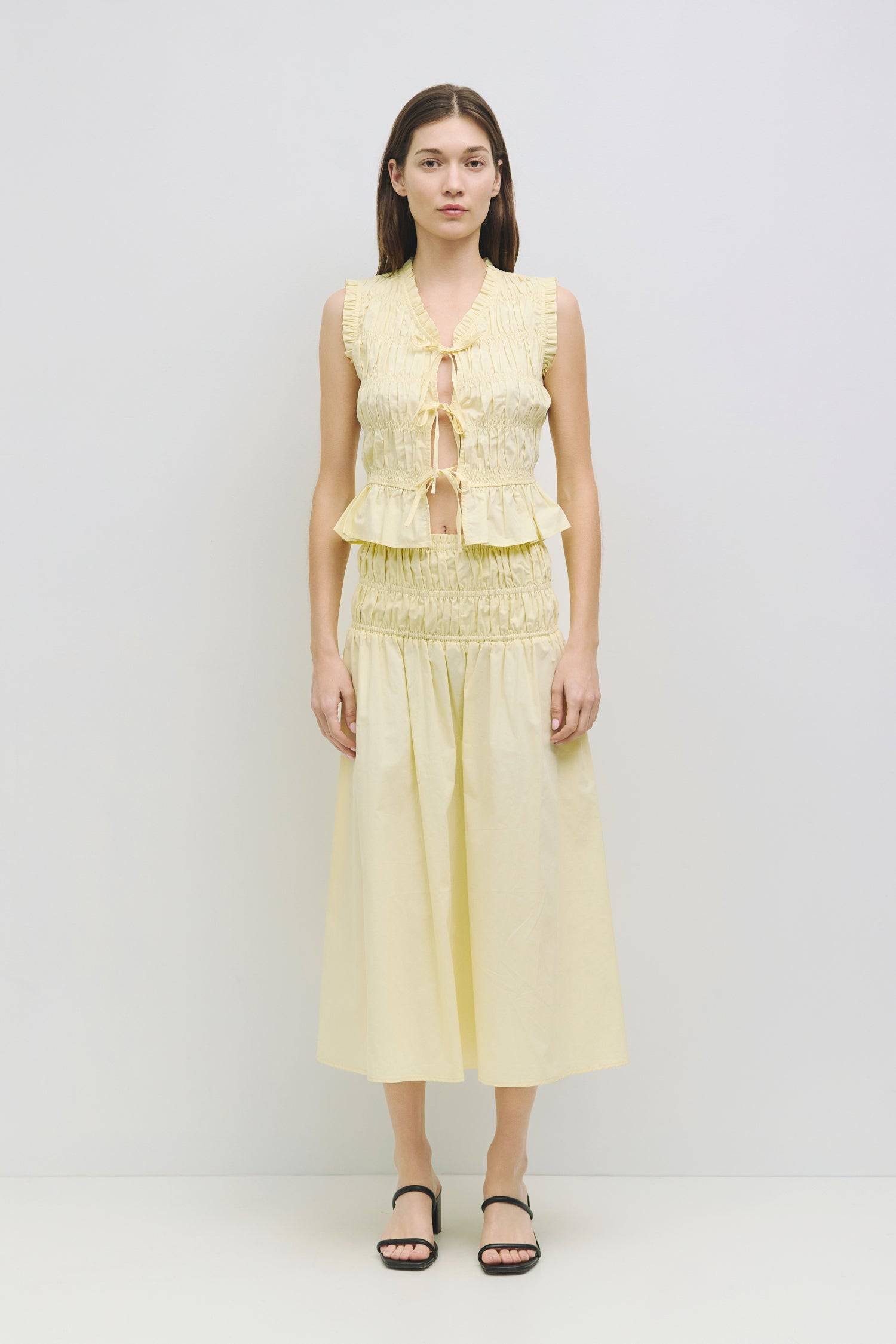 8929245167837, The Natasha Skirt, Bottoms, All Row, Black,Bottom,Bottoms,Breathable,cf-color-black,cf-color-white,cf-color-yellow,cf-size-l,cf-size-m,cf-size-s,cf-vendor-all-row,Comfortable,everyday,flowy,High Waist,Lime,Matching Set,Midi Skirt,new,POPLIN,Relaxed Fit,ruched,ruching,Semi-Formal,set,Sets,Skirt,spring,Summer,versatile,white,womens,Yellow, Information The Natasha Skirt is a comfortable midi-length skirt featuring a triple elasticized waistband and stylish paneled shirring detail at the waistlin