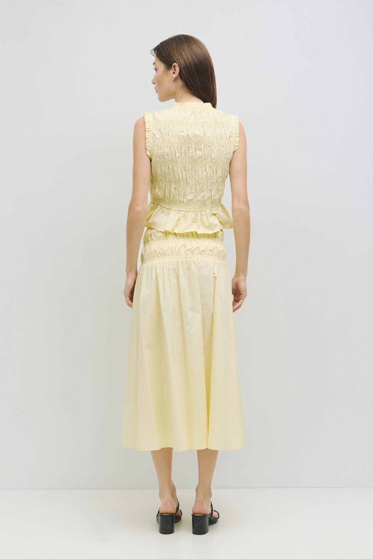 8929245167837, The Natasha Skirt, Bottoms, All Row, Black,Bottom,Bottoms,Breathable,cf-color-black,cf-color-white,cf-color-yellow,cf-size-l,cf-size-m,cf-size-s,cf-vendor-all-row,Comfortable,everyday,flowy,High Waist,Lime,Matching Set,Midi Skirt,new,POPLIN,Relaxed Fit,ruched,ruching,Semi-Formal,set,Sets,Skirt,spring,Summer,versatile,white,womens,Yellow, Information The Natasha Skirt is a comfortable midi-length skirt featuring a triple elasticized waistband and stylish paneled shirring detail at the waistlin