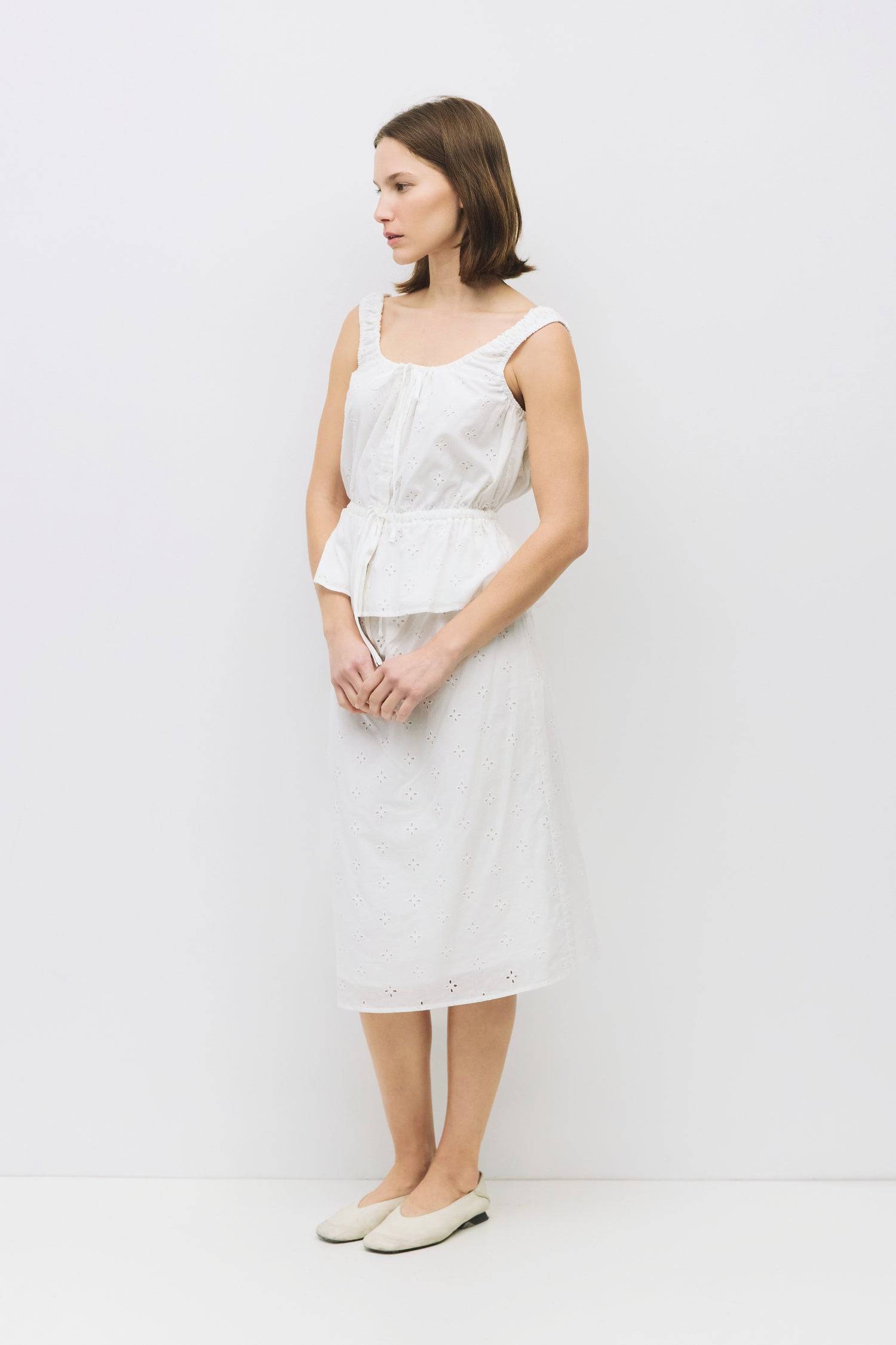 8983733502173, The Kristina Skirt, Dress, All Row, Black,Bottom,Bottoms,Casual,cf-color-black,cf-color-cream,cf-size-l,cf-size-m,cf-size-s,cf-vendor-mod-ref,Comfortable,Cotton,Cream,curve skirt,drawstring waist,Dress,Everyday,Form Fitting,Linen,linen-blend,maxi skirt,Midi Dress,midi length,new,Rib Knit,Ribbed,Sleeveless,Spring,Summer,womens, Information The Kristina Skirt is a relaxed-fit, midi-length cotton eyelet skirt with an elasticized waistband and adjustable tie for a comfortable fit. Fully lined for