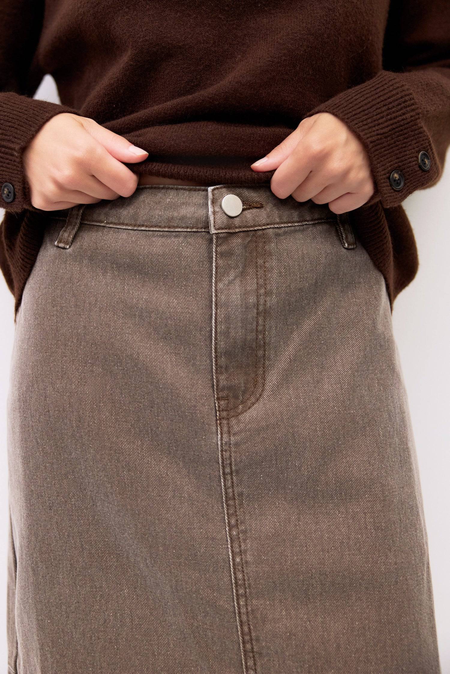 9045707784413, The Ryder Skirt, Bottoms, Mod Ref, a line,allrow,brown,Casual,cf-color-brown,cf-color-khaki,cf-color-white,cf-size-l,cf-size-m,cf-size-s,cf-size-xl,cf-size-xs,cf-vendor-all-row,cotton,Denim,denim skirt,Everyday,Feminine,front slit,Khaki,Midi,Midi Skirt,new,Pocket,Pockets,Relaxed,side pockets,Skirt,Women's, Information The Ryder Skirt is a midweight washed denim pencil skirt with a low-mid rise and a front slit for ease of movement. Its midi length and clean zipper closure create a timeless, v