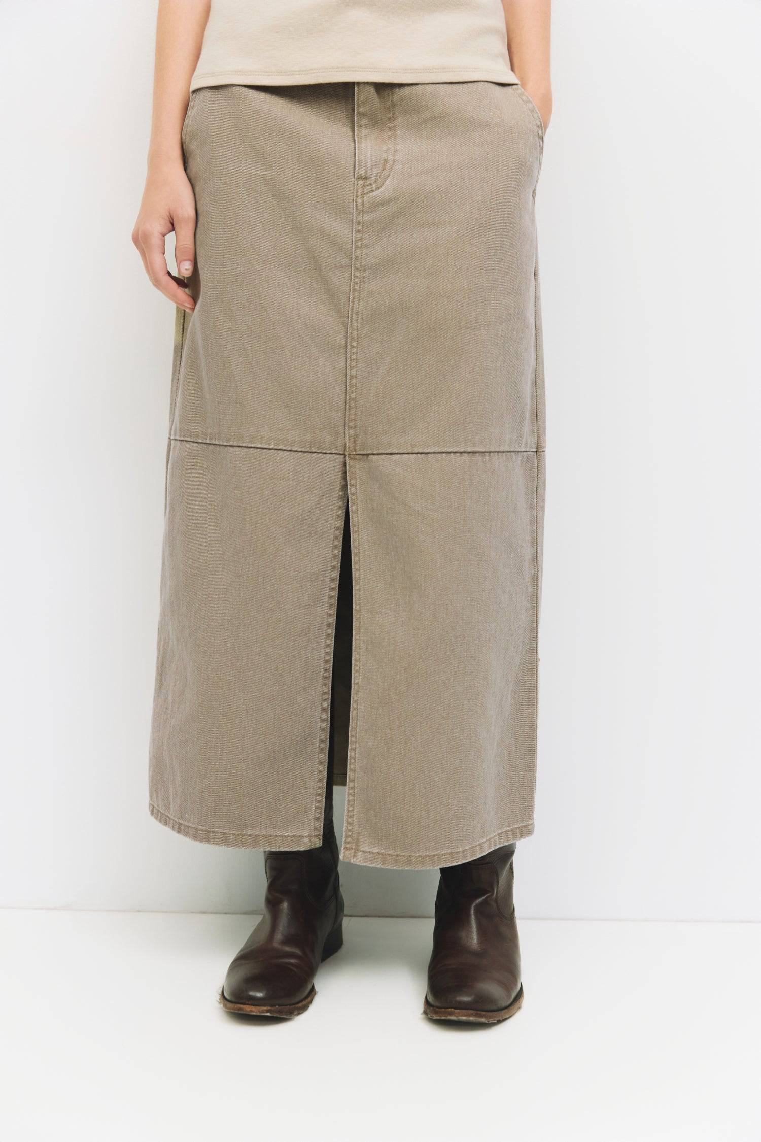 9045707784413, The Ryder Skirt, Bottoms, Mod Ref, a line,allrow,brown,Casual,cf-color-brown,cf-color-khaki,cf-color-white,cf-size-l,cf-size-m,cf-size-s,cf-size-xl,cf-size-xs,cf-vendor-all-row,cotton,Denim,denim skirt,Everyday,Feminine,front slit,Khaki,Midi,Midi Skirt,new,Pocket,Pockets,Relaxed,side pockets,Skirt,Women's, Information The Ryder Skirt is a midweight washed denim pencil skirt with a low-mid rise and a front slit for ease of movement. Its midi length and clean zipper closure create a timeless, v